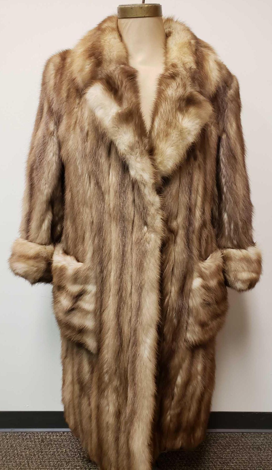 Full Length Stone Marten Fur Coat: Full Length Stone Marten Fur Coat. This coat is in fair used condition. There are various issues with ripping at the seams of this coat, but the most obvious are: one ~4" tear down the back (see image