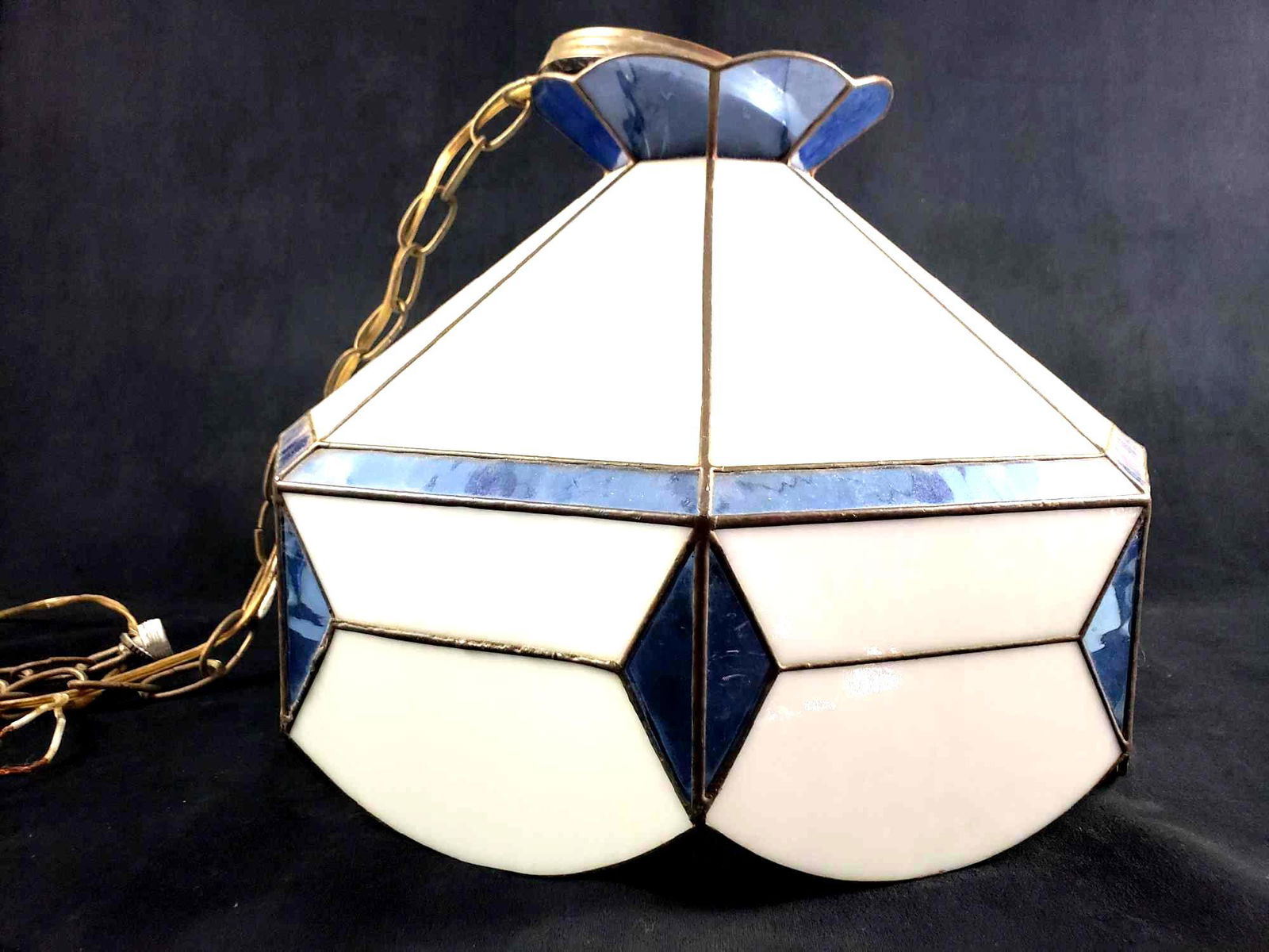 Tiffany Style Blue and White Stained Glass Hanging: Tiffany Style Blue and White Stained Glass Hanging Light. This stained glass hanging light is in great used condition. There are no known chips or cracks in the glass. It has a beautiful art deco styl