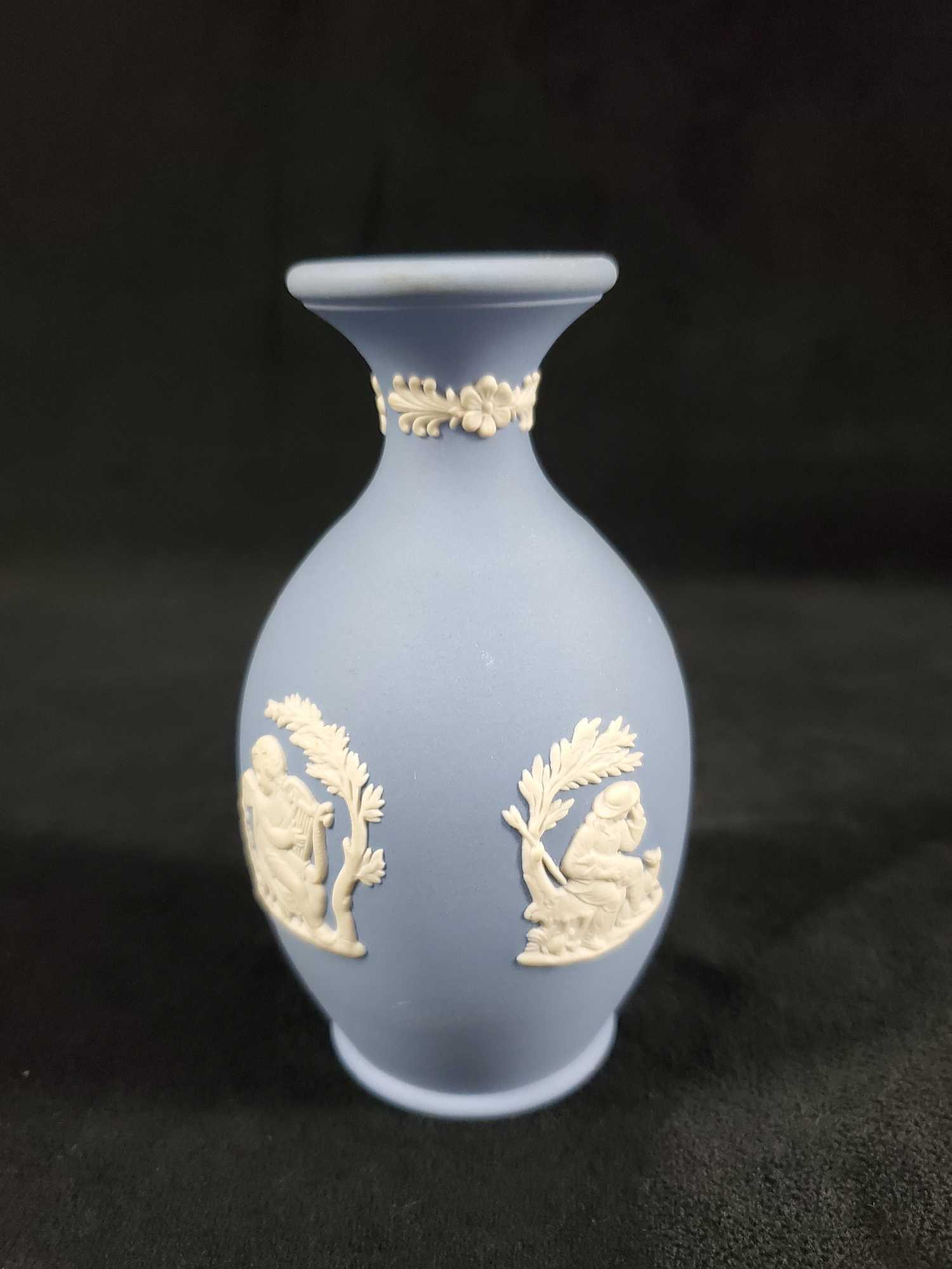 Vintage Wedgewood Cream On Blue Vase Fine China: Vintage Wedgwood Light Blue Jasperware Short Bud Vase. Has small textured images of characters from GreekÂ mythology. Vase is in good, vintage condition with only a few very minor scuffs on the side