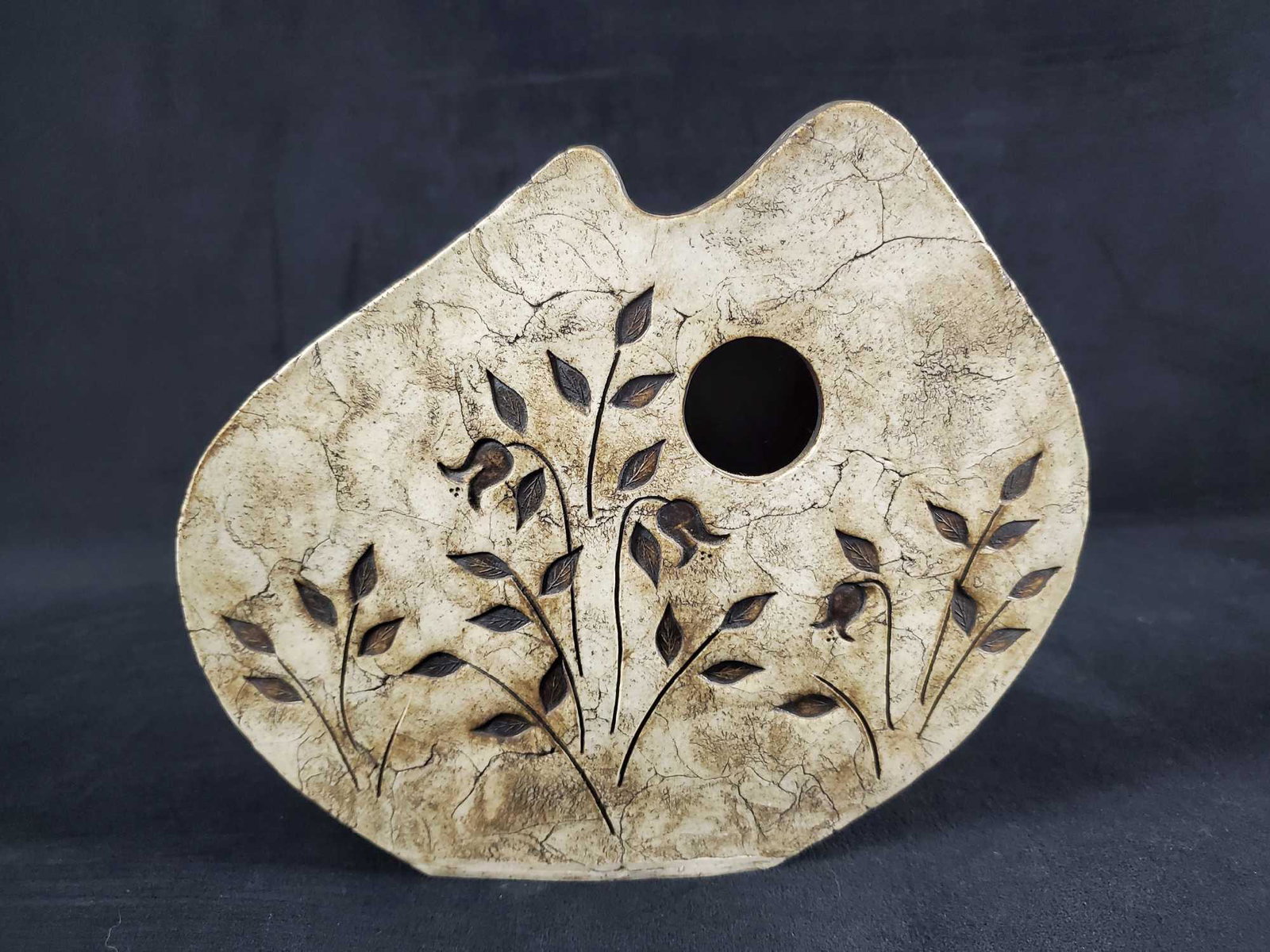 Modern Earthenware Art Vase: Modern earthenware art vase. Has an matte color finish with textured flowers on both side. Can be used as a pot for small flowers or just as art. Is approx 9" x 2" x 8". Vase is in good, used conditio