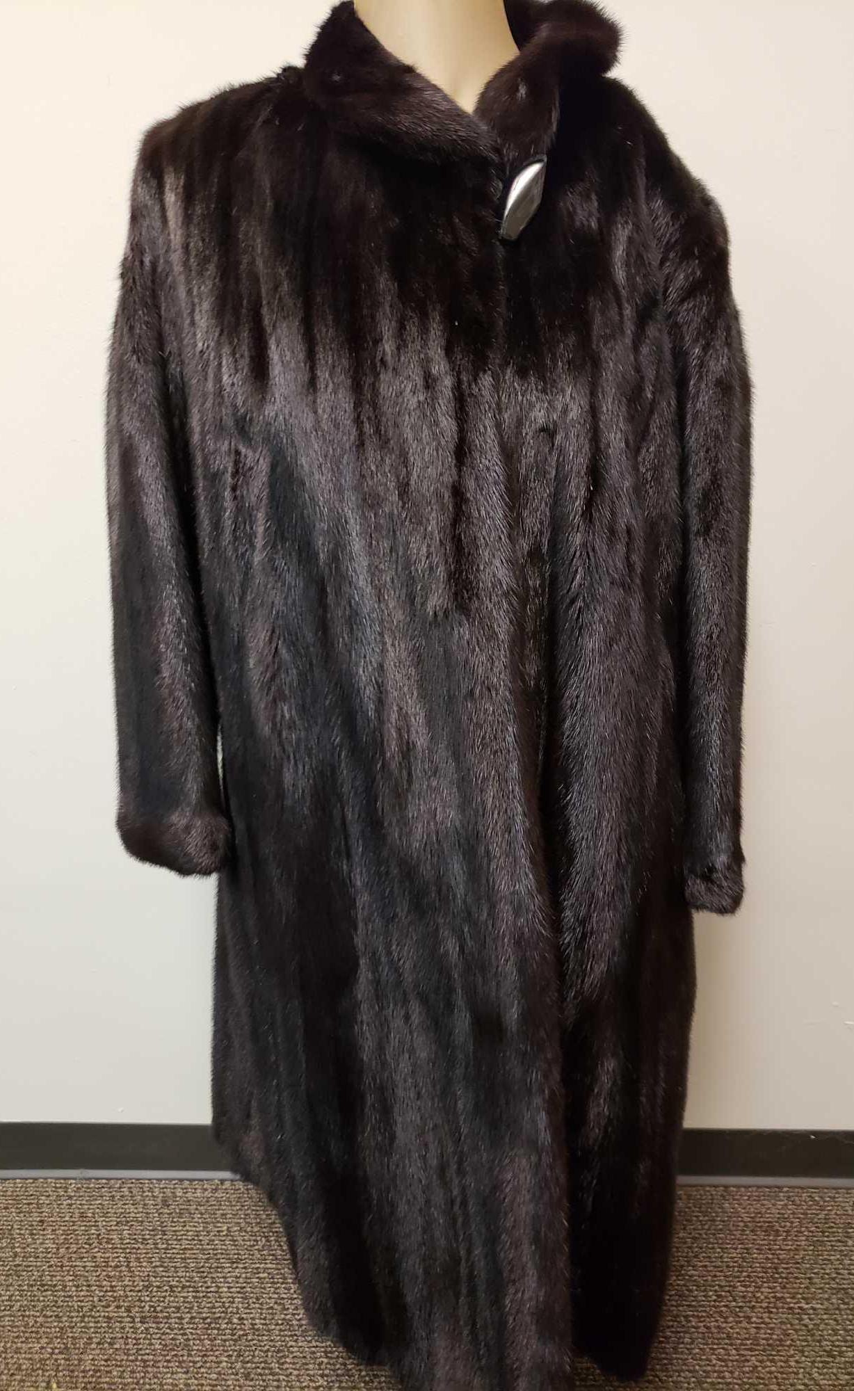 Saga Furs Superior Mink Fur Coat: Saga Furs Superior Mink Fur Coat. This fur coat is in great used condition. The coat has no known signs of damage to the interior or exterior of it. The coat has a black fabric interior lining with a