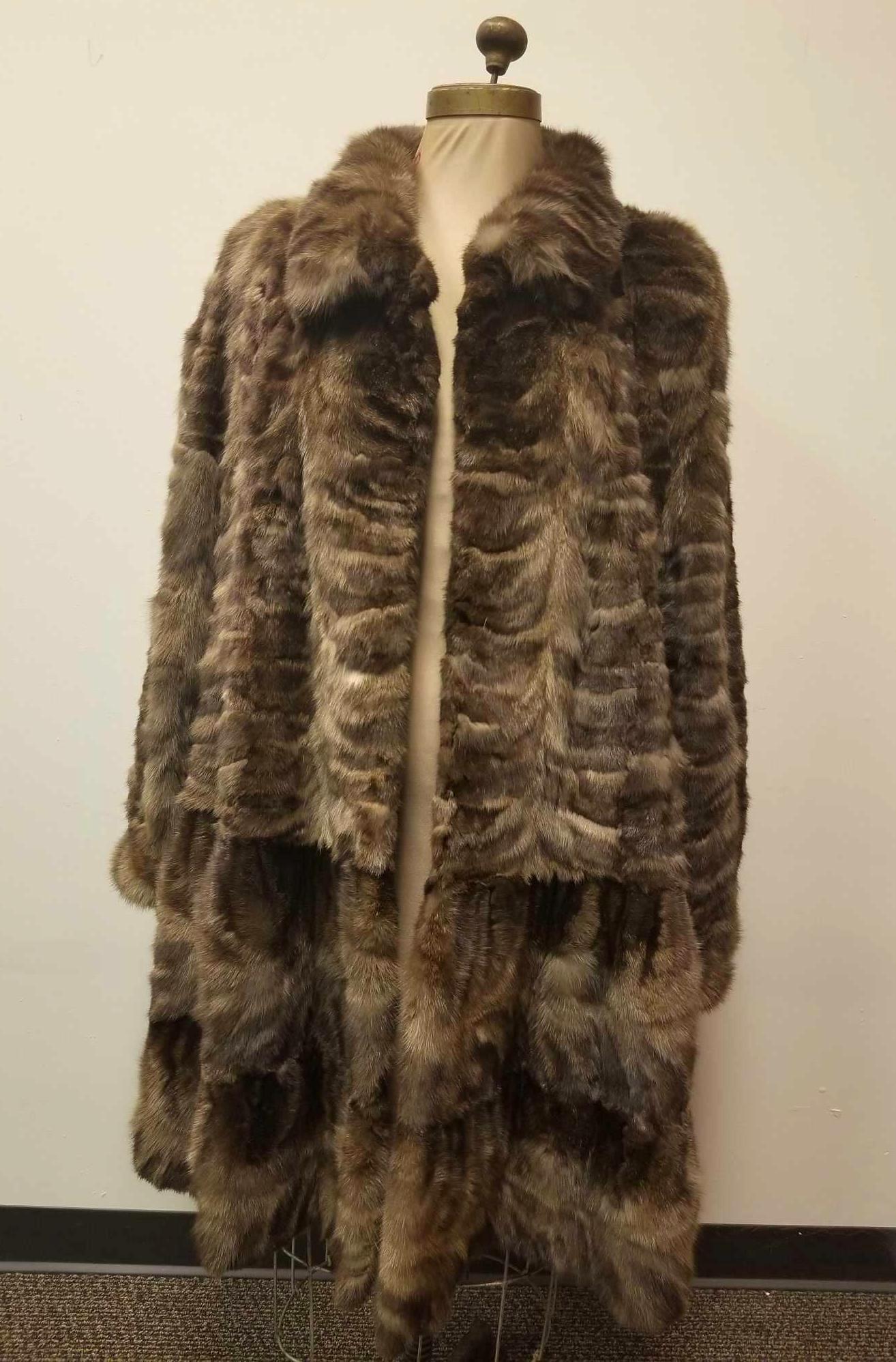 Unique Starlet Full Length Sable Fur Coat with Flare: This full length sable fur coat features a dramatic flare bottom and unique pattern. 1940's Hollywood style feel. Made by an unknown manufacturer and date. This coat features brown satin linen interio