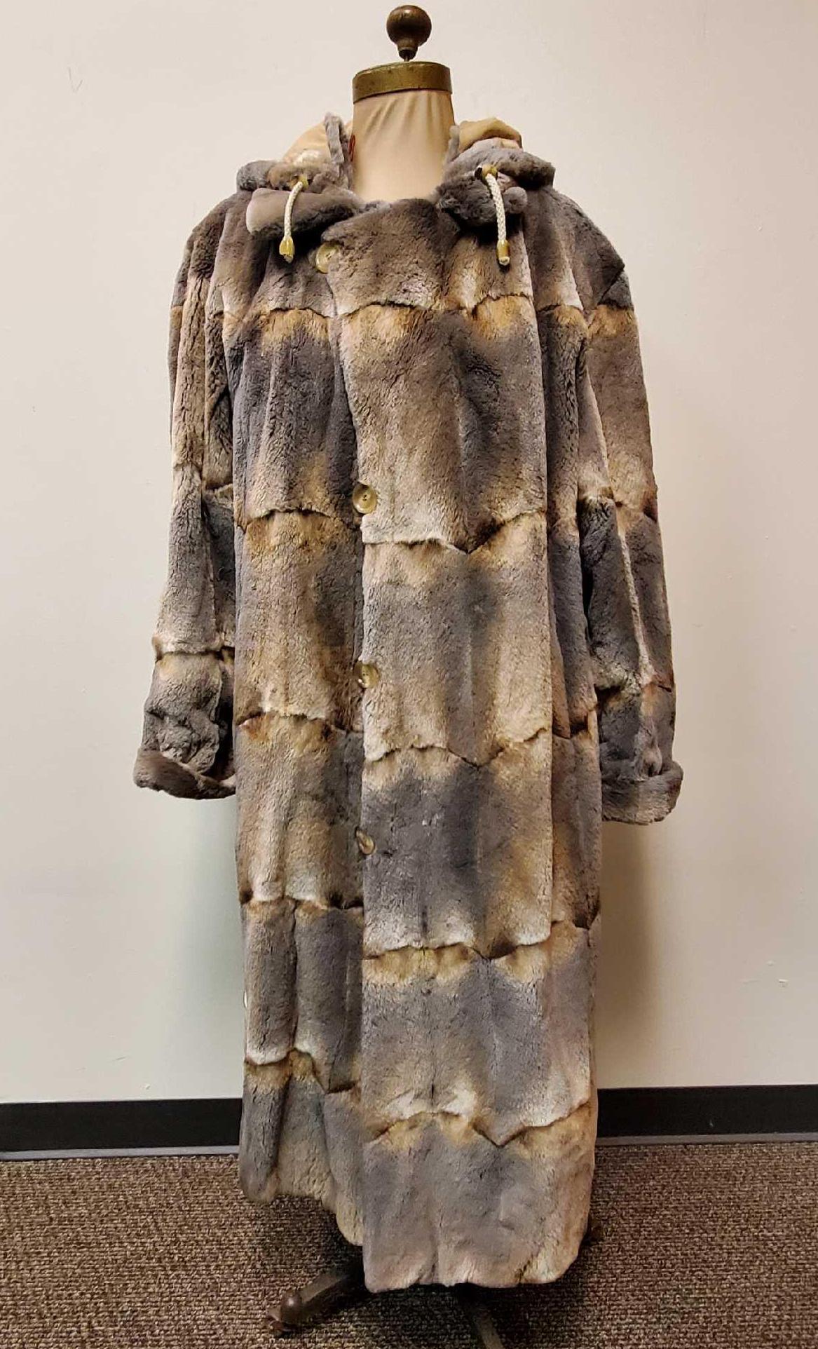 Reversible Natural Mink Trench Coat W Detachable Hoodie: This full length reversible natural mink fur coat is by an unknown manufacturer but it is of fine quality and condition. It is in like new condition with no known damages. The pattern is unique and de