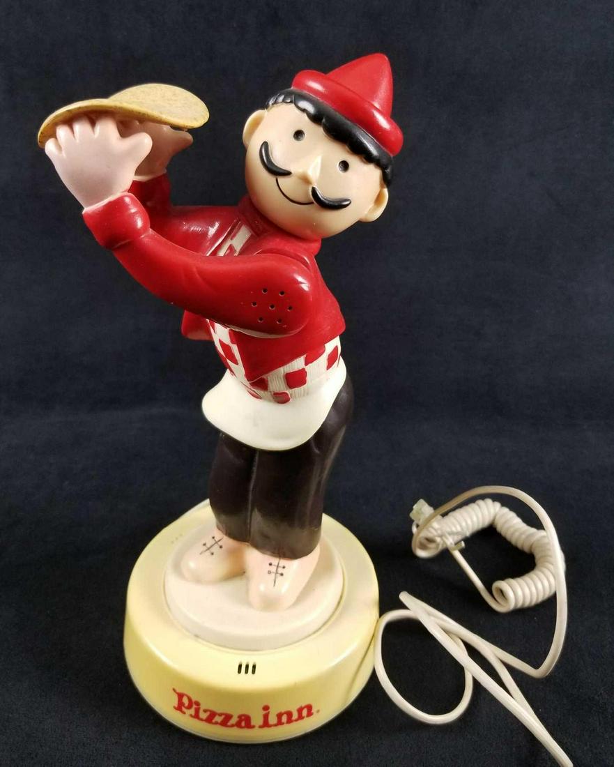 Vintage Pizza Inn Man Flipping Dough Touch Dial: Pizza Inn Man Flipping Dough Touch Dial Telephone. This phone is a great vintage find and would look great in a diner. It depicts a pizza maker flipping dough on a base with the words Pizza Inn. The p