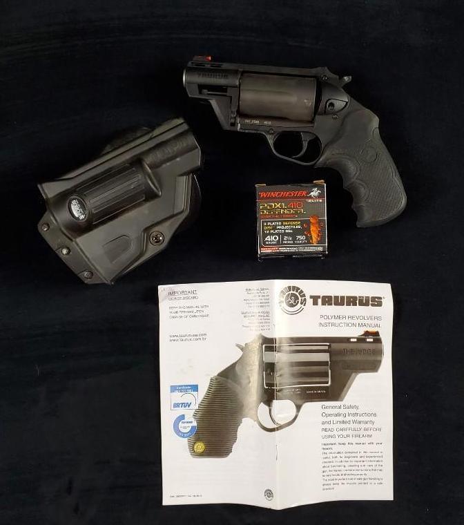 Taurus Public Defender Poly 45 COLT The Judge Handgun: Taurus Public Defender Poly, The Judge Revolver Handgun, holster and a pack of PDX1Â defender ammunitions. Model Number: .45 long colt | 410GA, serial number: LY497514. Made in Brazil.Â Â 2"barr