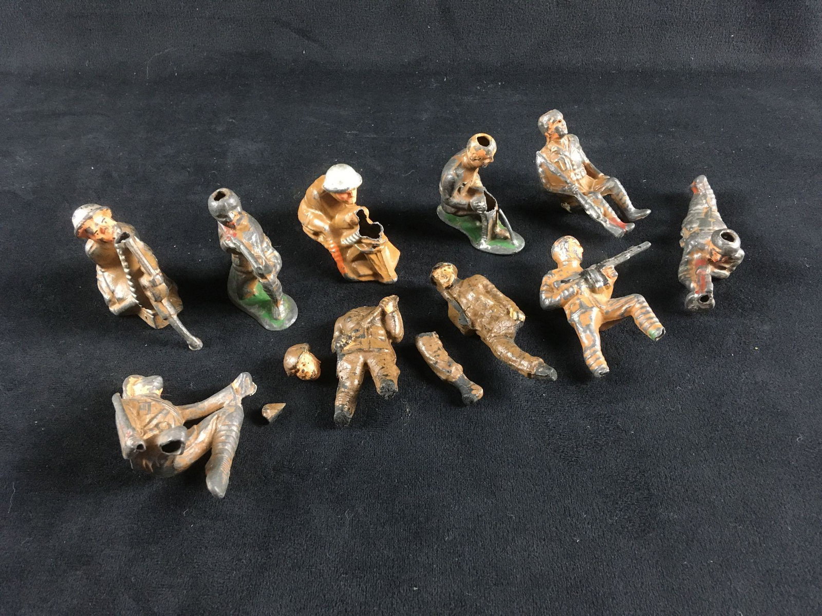 10 Vintage WW I Toy Soldiers: 10 Vintage WW I Toy Soldiers; this little squadron appears to have suffered a few casualties coming out of the trenches and entering No Man's Land. All show a loss of material. It appears they are wit