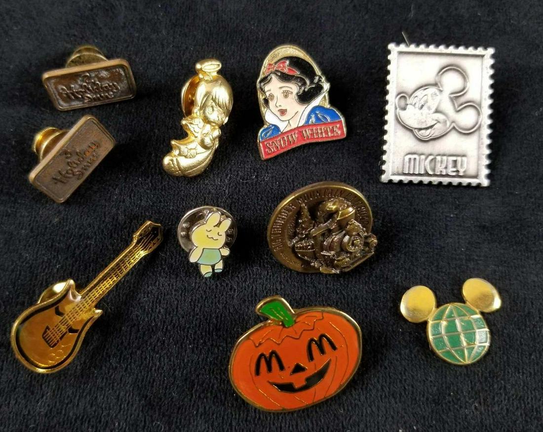 Lot of 10 Disney and Pop Culture Collector Pins: This lot includes twoÂ Rare Vintage Holiday Inn Hotel Service/Employee pins, one Mickey Mouse pewter stamp pin, one Walt Disney World Big Thunder Mountain pin, one McDonalds Halloween pin, one Snow