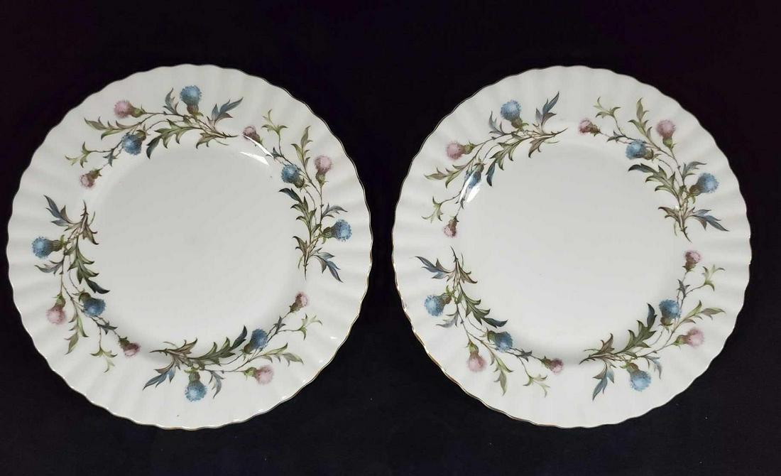 Royal Albert English Bone China Plates Lot Of Two: This includes two vintage English Bone China "Brigadoon" dinner plates made by Royal Albert. Cream colored plate with gold trimming and colorful blue and pink flower designs with scalloped edges. Plat