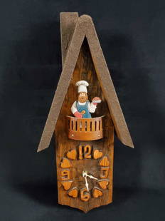 Wooden Bakerman Wall Clock: This wooden wall clock features an adorable baker man holding a pie on a deck with carved numbers and hearts. It is made by an unknown manufacturer with Japan clock parts. There are no known damages