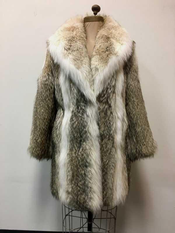 Fine Silver Fox Fur Mid Length Coat: Fine Silver Fox Fur Mid Length Coat; a beautiful coat showing much contrast in color. An attached label reads "York Furriers, Elmhurst, Illinois". The coat shows two (2) clasps on the front and a butt