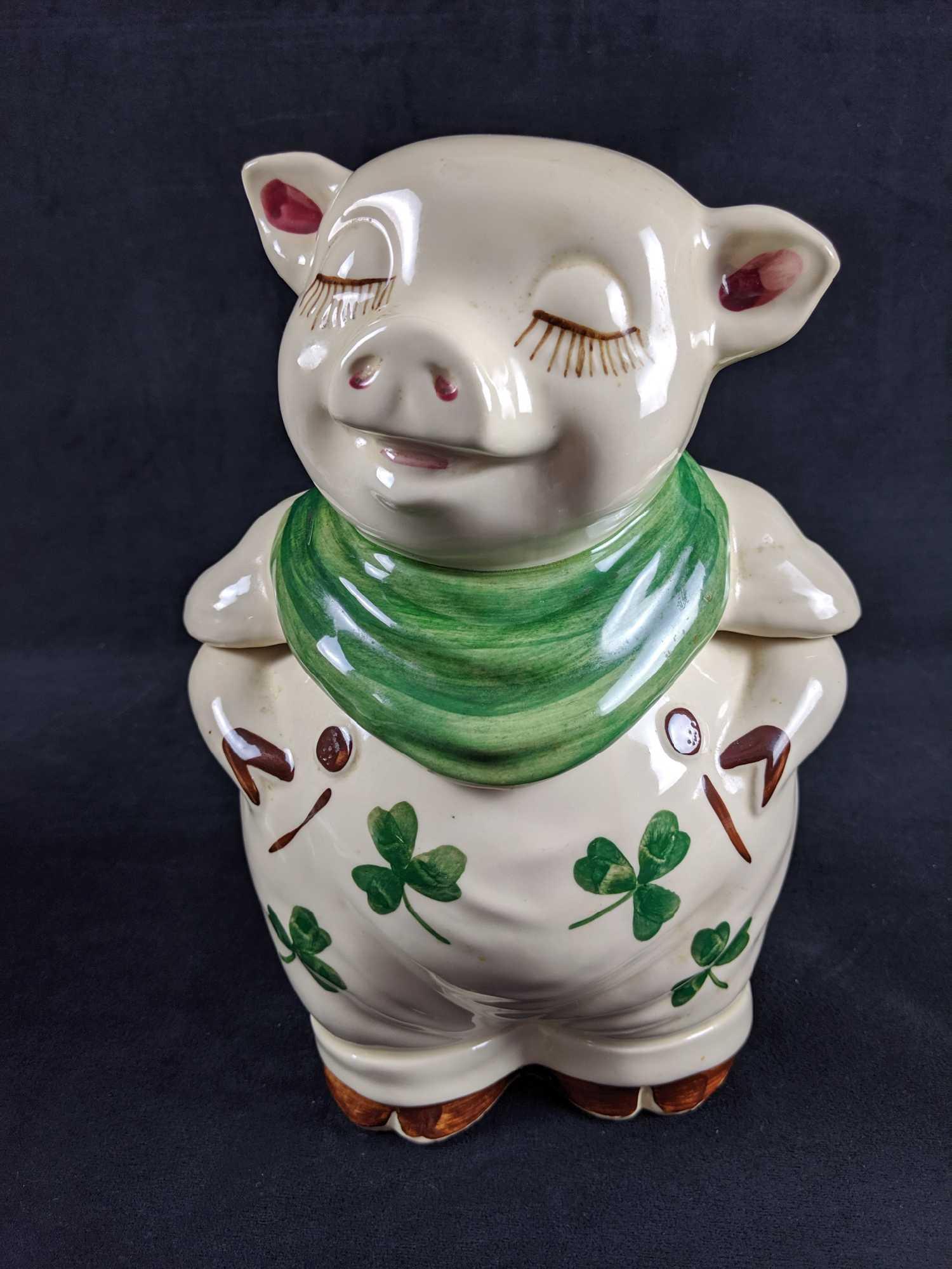 1940s Shawnee Smily Pig Cookie Jar Green Clover: This happyÂ Porcelain pig hand painted cookie jar is approx 7" x 4" x 12"Â Is in good, vintage condition with no noticeable chips or scratches, although there appears to be a small marking on pig