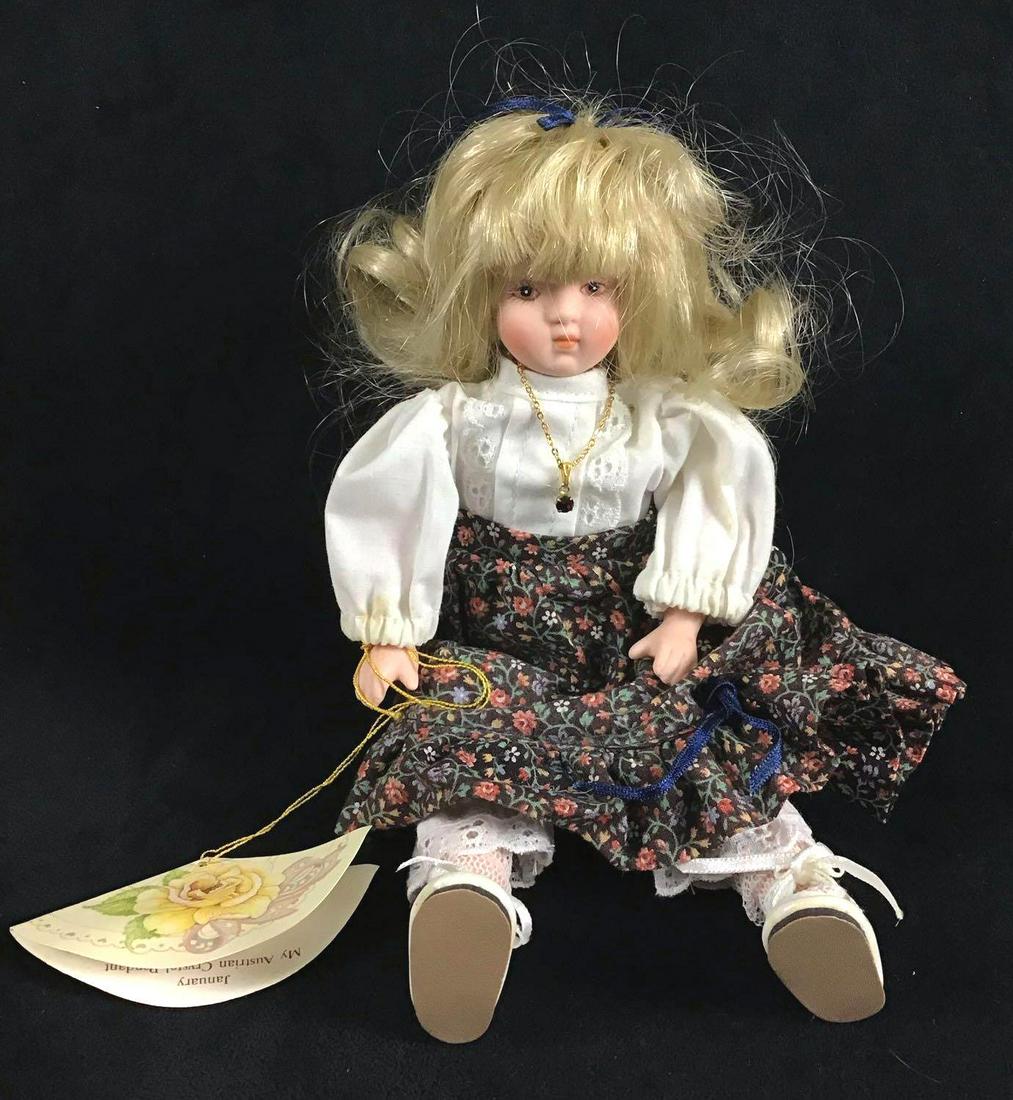 Vintage Victoria Ashley Originals Porcelain Doll: Vintage Victoria Ashley Originals Porcelain Doll designed by Karen Kennedy. She is a limited 1339/5000 doll. She was produced for Goebel Inc in 1989. She was made in Taiwan. She is wearing a "Garnet"