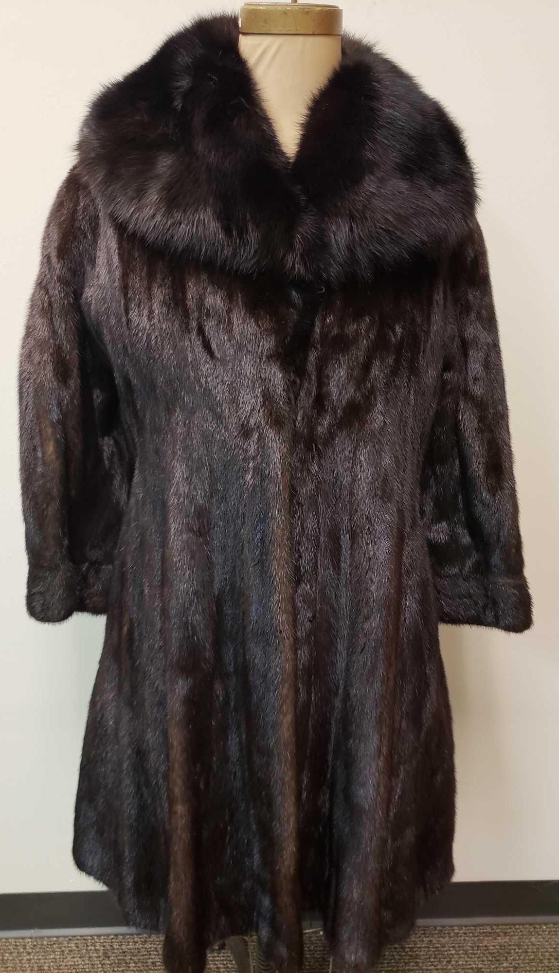 Abrahamsons Oak Park Diamond Black Mink Fur Coat with: Abrahamsons Oak Park Diamond Black Mink Fur Coat with Sable Collar. This fur coat is in good used condition. The coat has two small tears in the interior lining (see images). The coat has a black fabr