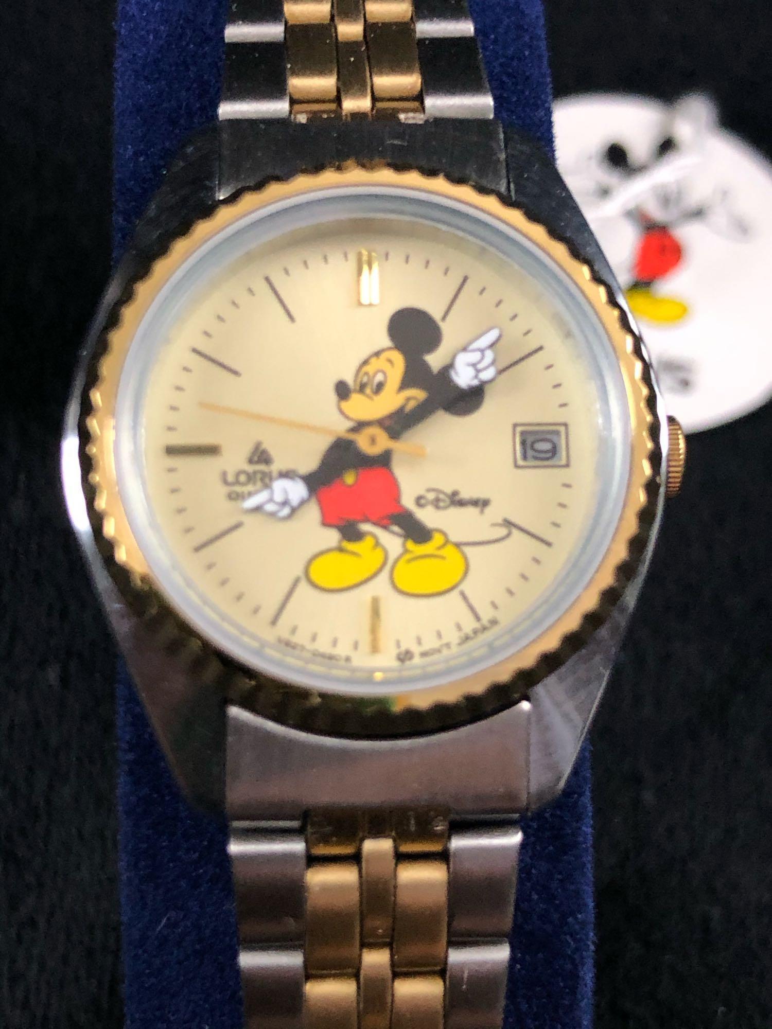 Lorus Quartz Mickey Mouse Metal Band Two Tone Gold: Lorus Quartz Mickey Mouse Metal Band Two-Tone Gold Stainless Steel Water Resistant Watch A The adjustable gold-tone strap is in great condition. Stainless steel back base bezel with no known scuff mar