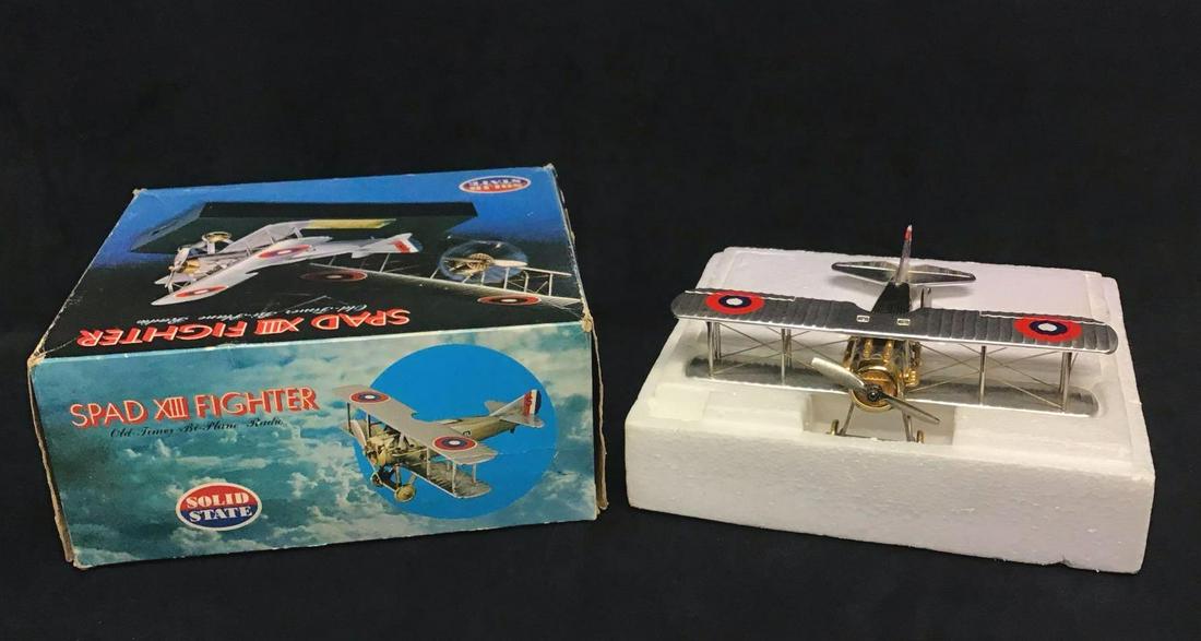 Solid State Spad XIII Fighter Old Timer Bi Plane Radio: This is a vintage model aircraft of the Spad XIII Fighter made by Solid State in Japan. The model plane is made of a hard metal and the radio is made of a hard plastic. The radio has a stand to secure