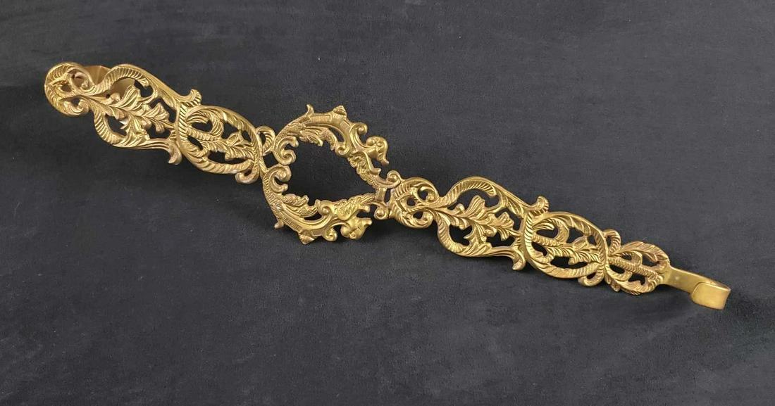 Vintage Brass Door Hanger From India: Vintage solid brass door hanger made in India. Has an unique and detailed floral pattern with an heart in the middle. Is approx 15" across. Hanger is in good, vintage condition with only minor wear on