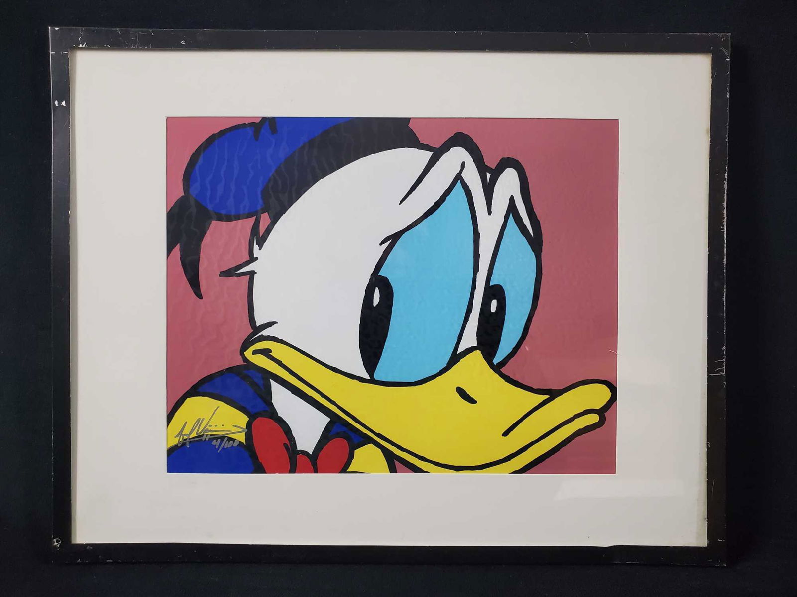 Framed Limited Edition Disney Donald Duck Print: Bright and colorful print of a very worried Donald Duck. Print is signed and numbered (4/100). The name of the artist is unknown. Image is approx 9" x 7 1/2". Frame is approxÂ 14" x 11". Frame has a