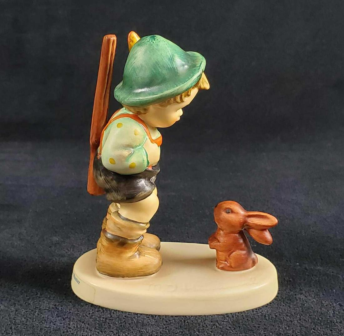 Hummel Goebel Figurine Sensitive Hunter HUM 6 20: Boy dressed in traditional Bavarian clothing confronts a bunny. Figure is approx 3" 1 1/2" x 4". The figure is in good vintage condition with no known damage. Hand-painted porous earthenware. Made in