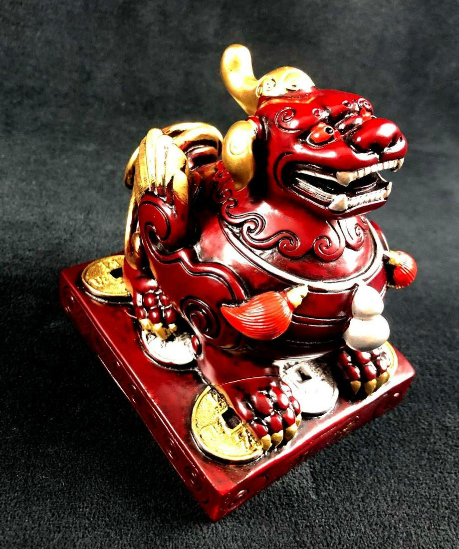 Chinese Ancient Dog Dragon Statue Figurine: The dragon dog is sitting on a traditional Chinese ancient Shui Lucky coins for good fortune. Color in dark burgundy with red and gold trimming. There are no known cracks or chips. Made of solid