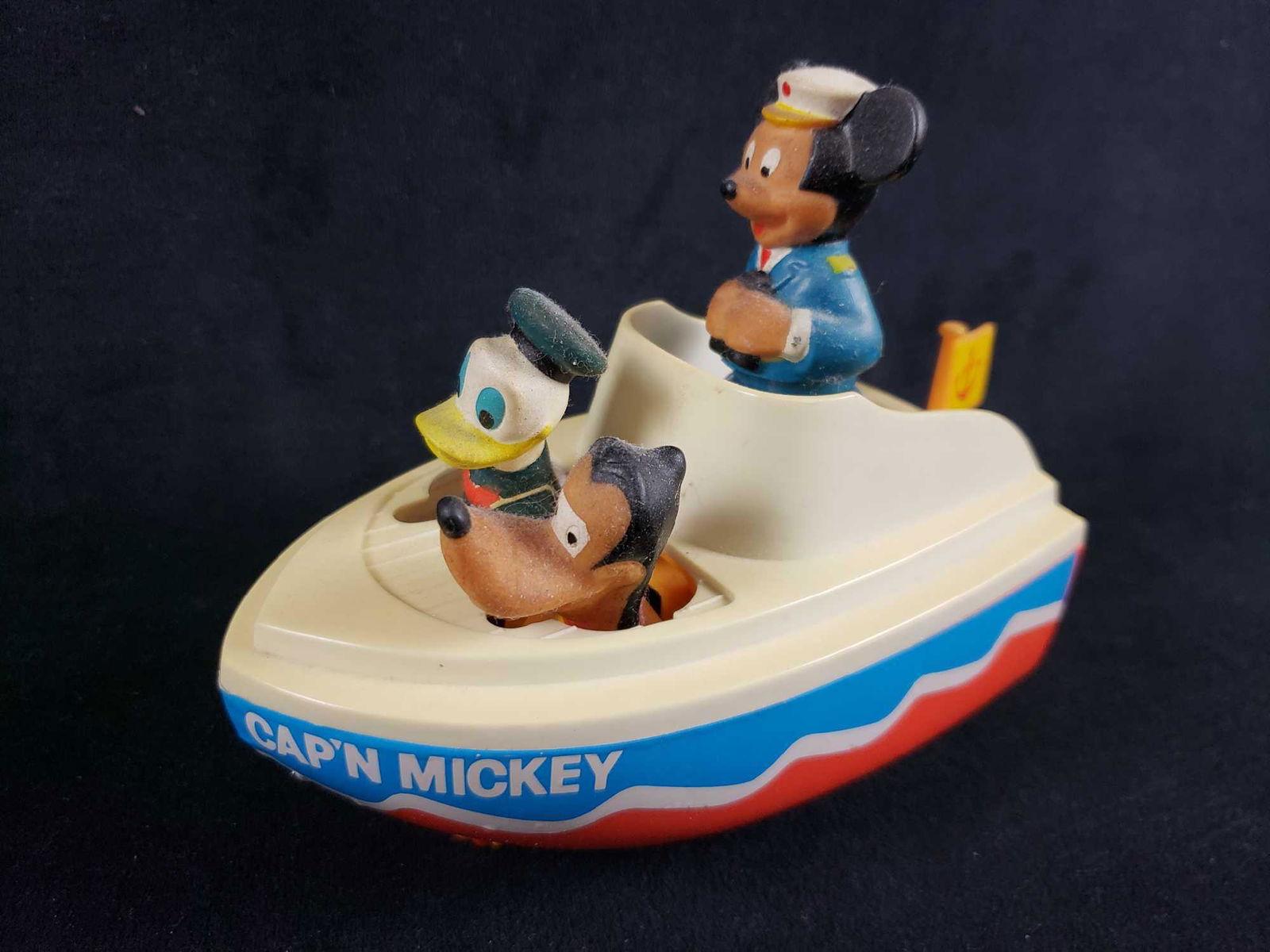 Walt Disney Productions Illco Capn Mickey Wind Up Boat: Walt Disney Productions Illco Capn Mickey Wind Up Boat Toy. This Cap'n Mickey wind up boat toy is in good used condition. The item is relatively old and as such has signs of age such as discoloration