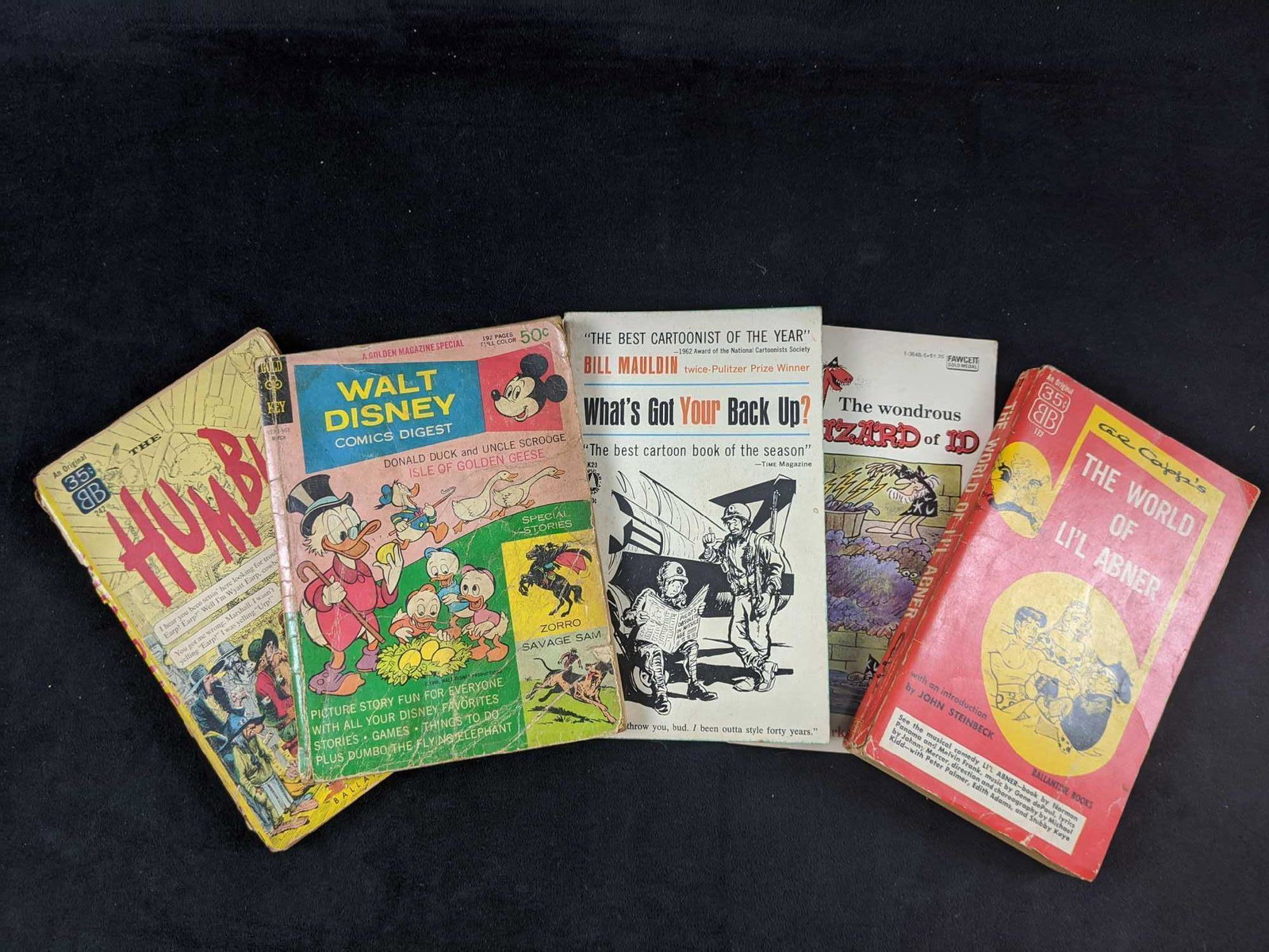 Vintage Classic Cartoon Books Lot Of Five: This lot includes: (1) Walt Disney Comics Digest by Walt Disney Productions. Published in 1969 by Gold Key comics. Book is in fair, used condition with storage wear. First page has an small rip.Bottom