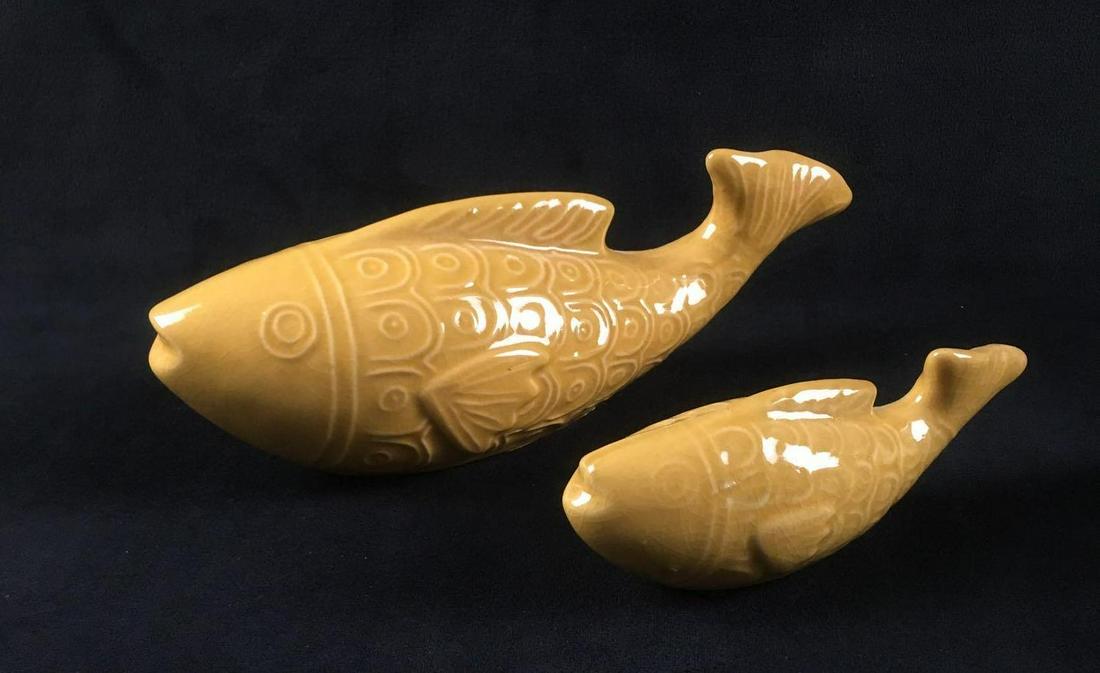 2 Foreside Home and Garden Ceramic Yellow Fish: 2 Foreside Home and Garden Ceramic Yellow Fish. These fish are in great condition. The fish have a yellow glaze finish and molded design. These fish are meant to be garden decorations. One fish is lar