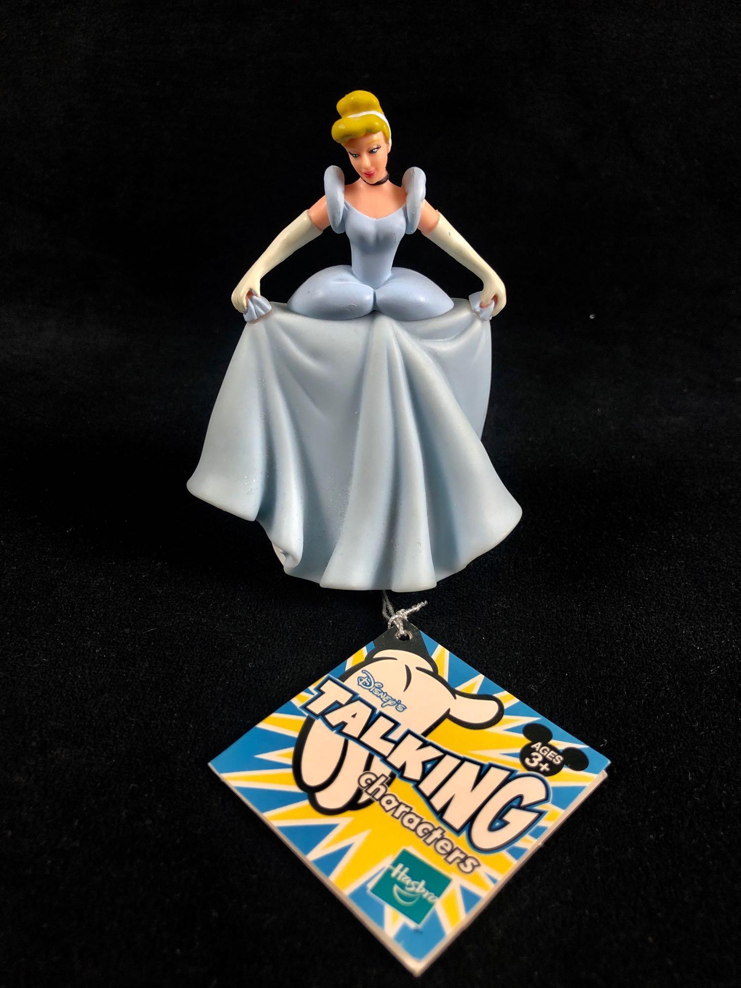 Disney Cinderella Talking Characters Hasbro Plastic: Disney Cinderella Talking Characters Hasbro Plastic Figurine Cinderella says 7 things by pressing the bottom at the bottom of the dress. The voice is still clear to hear each question or expression.Â