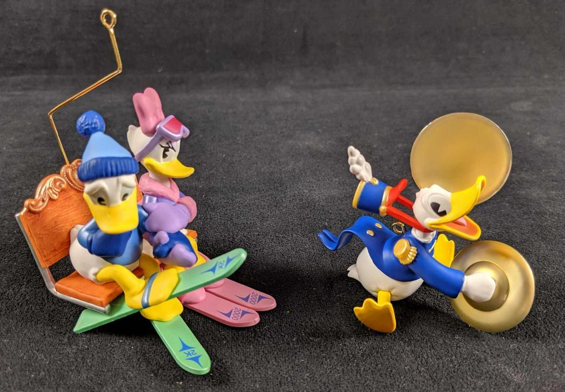 Retired Disney Hallmark Keepsake Donald Duck Ornaments: Comes with: "Donald and Daisy at Lovers Lodge". This adorable ornament is part of the Romantic Vacation series and is approx 3" x 2" x 4". Was released at 2000. And "Donald Plays The Cymbals" which is