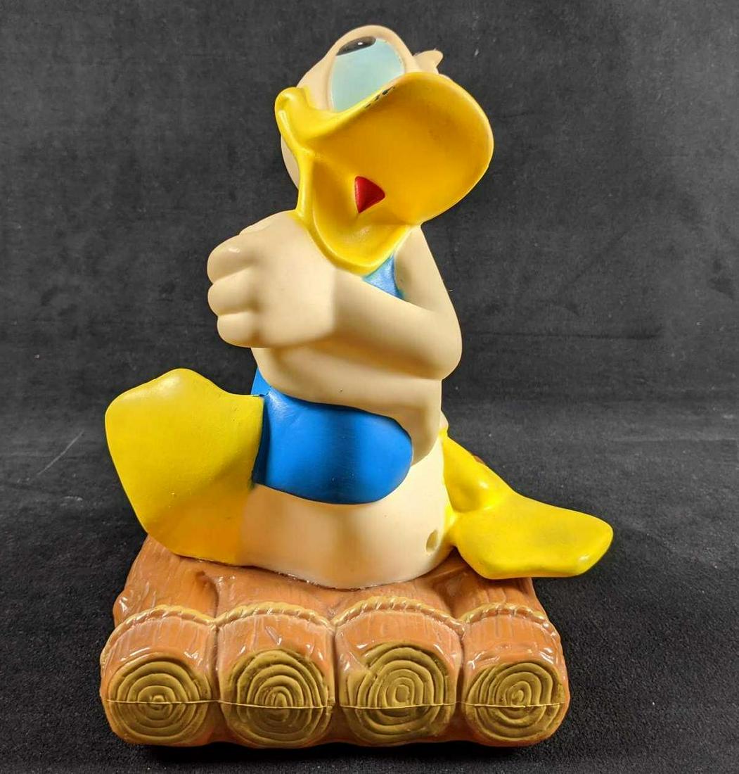 Vintage Donald Duck Wood Raft Walt Disney Productions: This Illco Toy is a floating bath toy featuring everyone's Disney Duck -DONALD!!! It measures approx 7"x 7" x 8 1/4" and it is made of durable rubber. Toy is marked on the rear and on the bottom of th