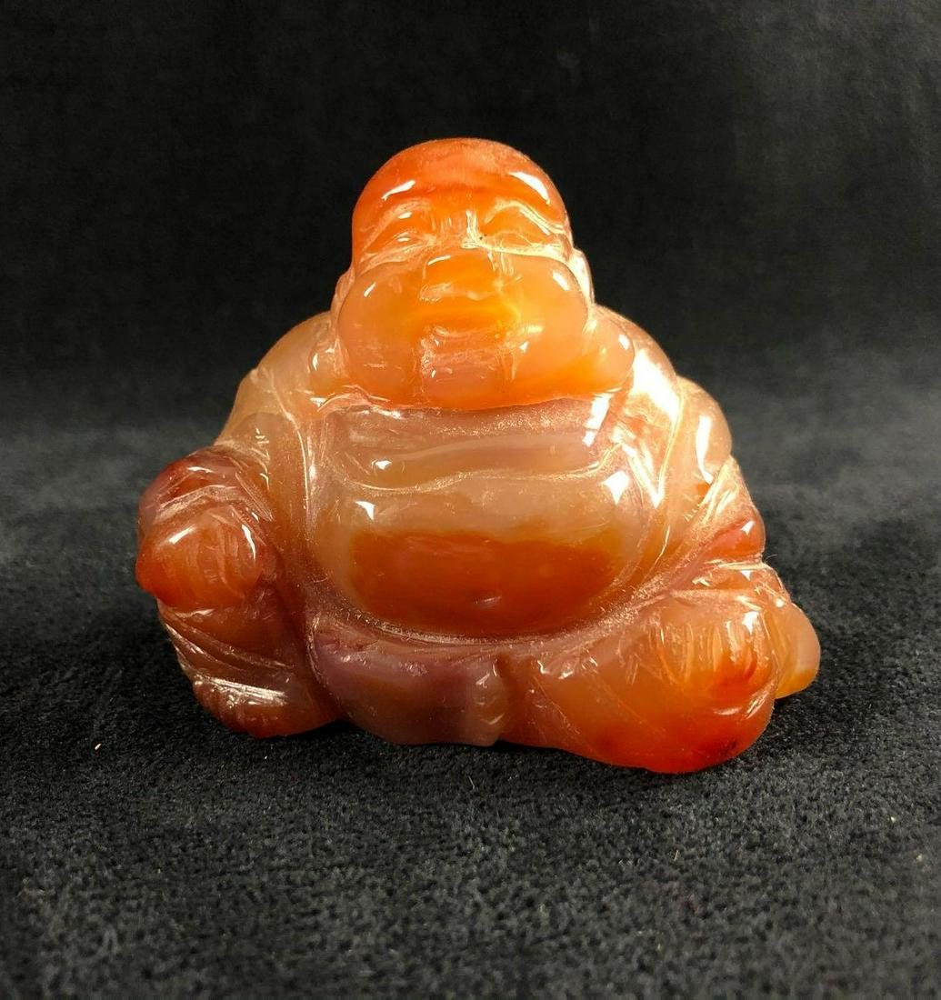 Hand Carved Buddha Happy Sitting Laughing Agate: Hand Carved Buddha Happy Sitting Laughing Agate Translucent Brown Beige Gold Sculpture Figurine Hand-carved agate with subtle translucent shades of color into the Happy Sitting Buddha. He appears to b