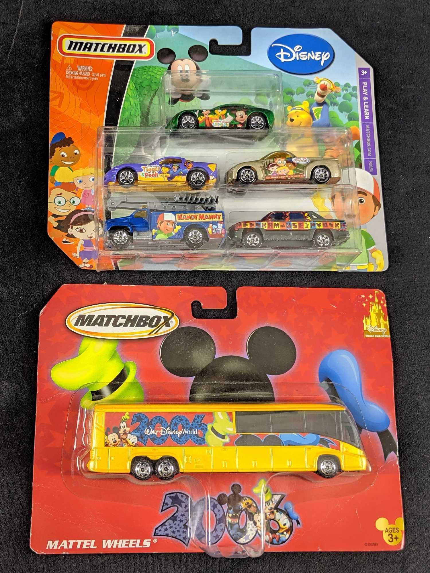 Lot Of Two Disney Die Cast Collectable Metal Matchbox: Lot consists of: Retired Walt Disney World matchbox 2006 Disney theme-park bus.While the box has slightly bent corners, it's unopened so bus is in good condition with no visible damage. Package is app
