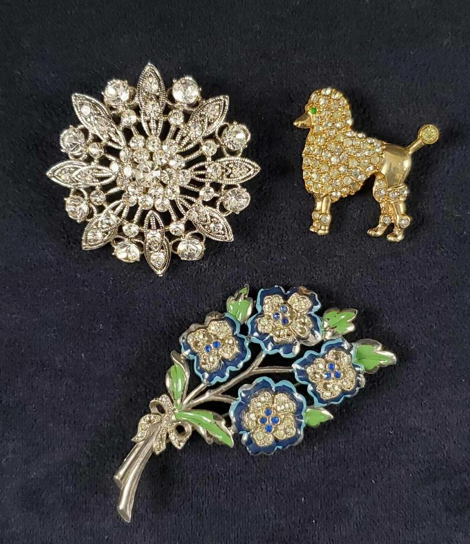 Vintage Lot of 3 Brooches Floral Poodle: This vintage lot of 3 brooches consists of: 1- Ernest Steiner, 1950's,Â Gold Tone with green and clear rhinestones poodle pin. Marked by maker on back. All rhinestones in place and approx. measures�