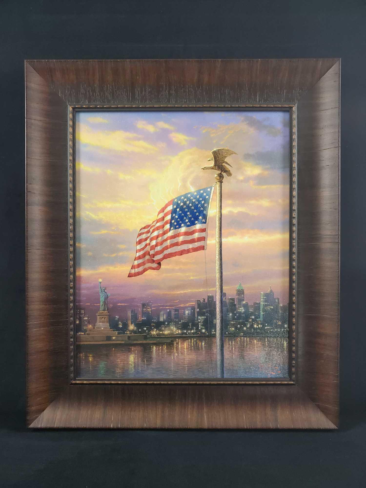Framed Thomas Kinkade Light Of Freedom New York: Framed Thomas KinkadeÂ "The Light Of Freedom" Brushstroke Vignette of "The Light Of Freedom". Shows the American Flag with New York and the Statue Of Liberty in the background. Comes with an 'Rich B
