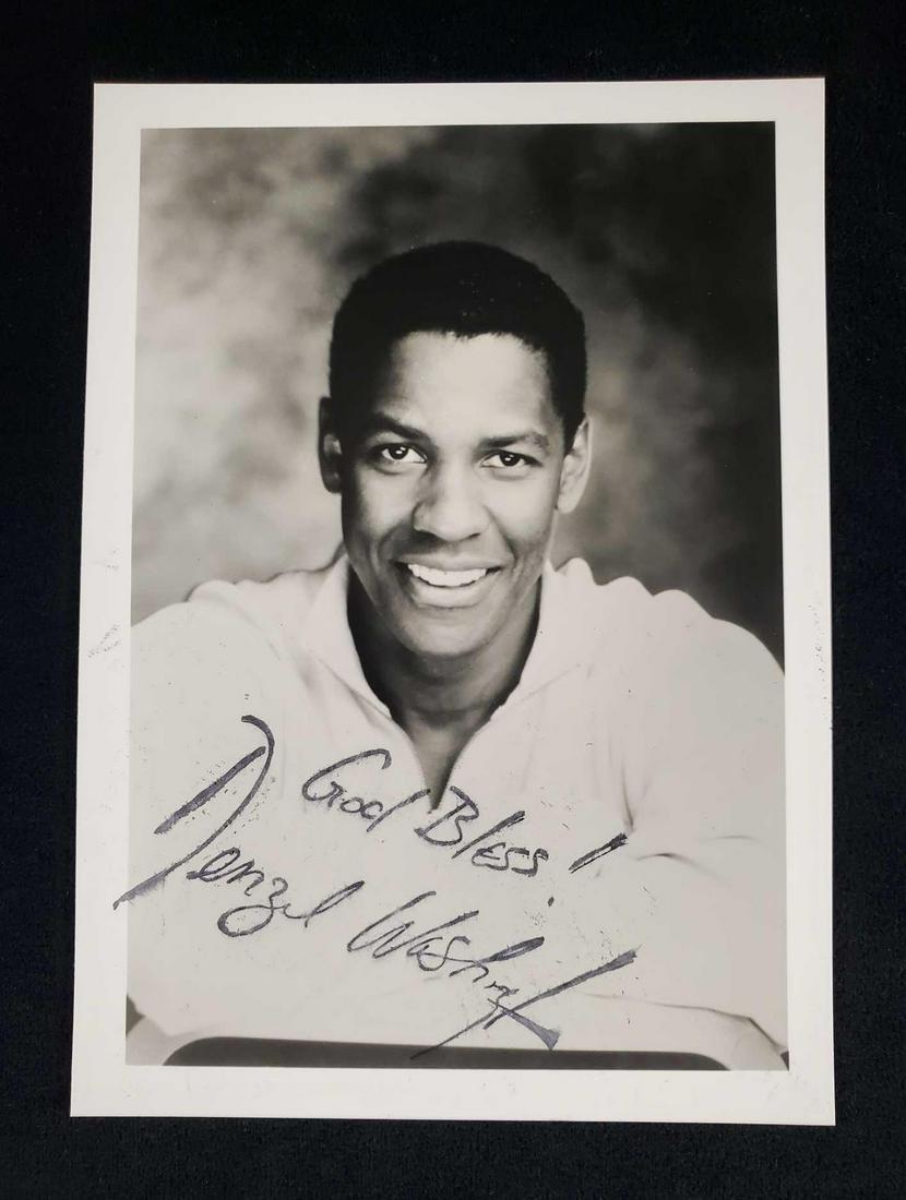 Autographed Photo of Early Denzel Washington: "God Bless!" Signed Densel Washington. The Ink has smudged. No COA Comes from the estate of avid autograph collector. Measures approx 5" x 7".Â