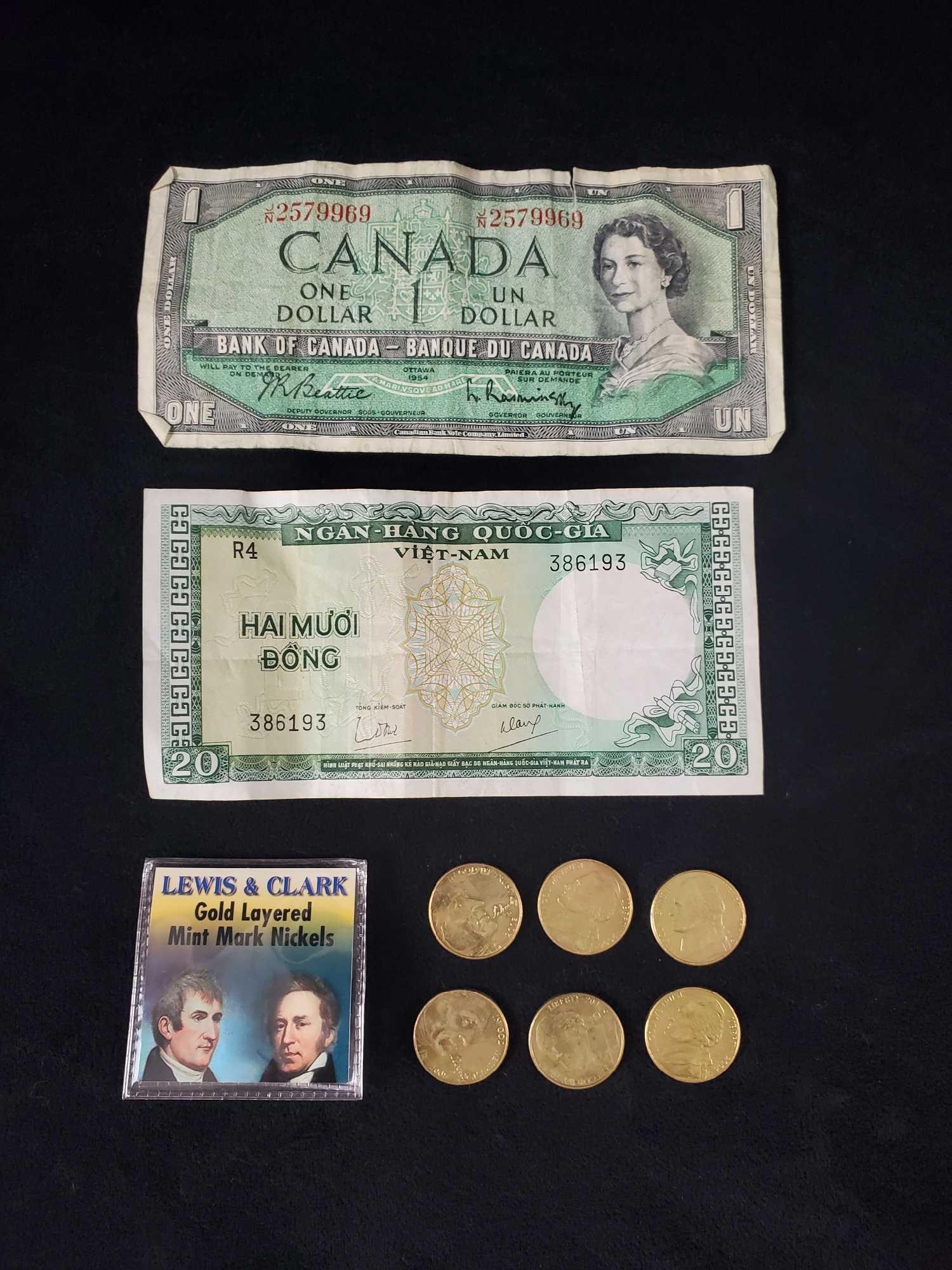Gold Layered Nickles And Candian Viet Nam Money: This lot includes: (1) Vietnam 20 Dong Bank Note. 1964. Bill is in good, used condition with folds in the middle and a white mark in the middle of the back of the bill. Is approx 5 1/2 x 3". (1) Canad