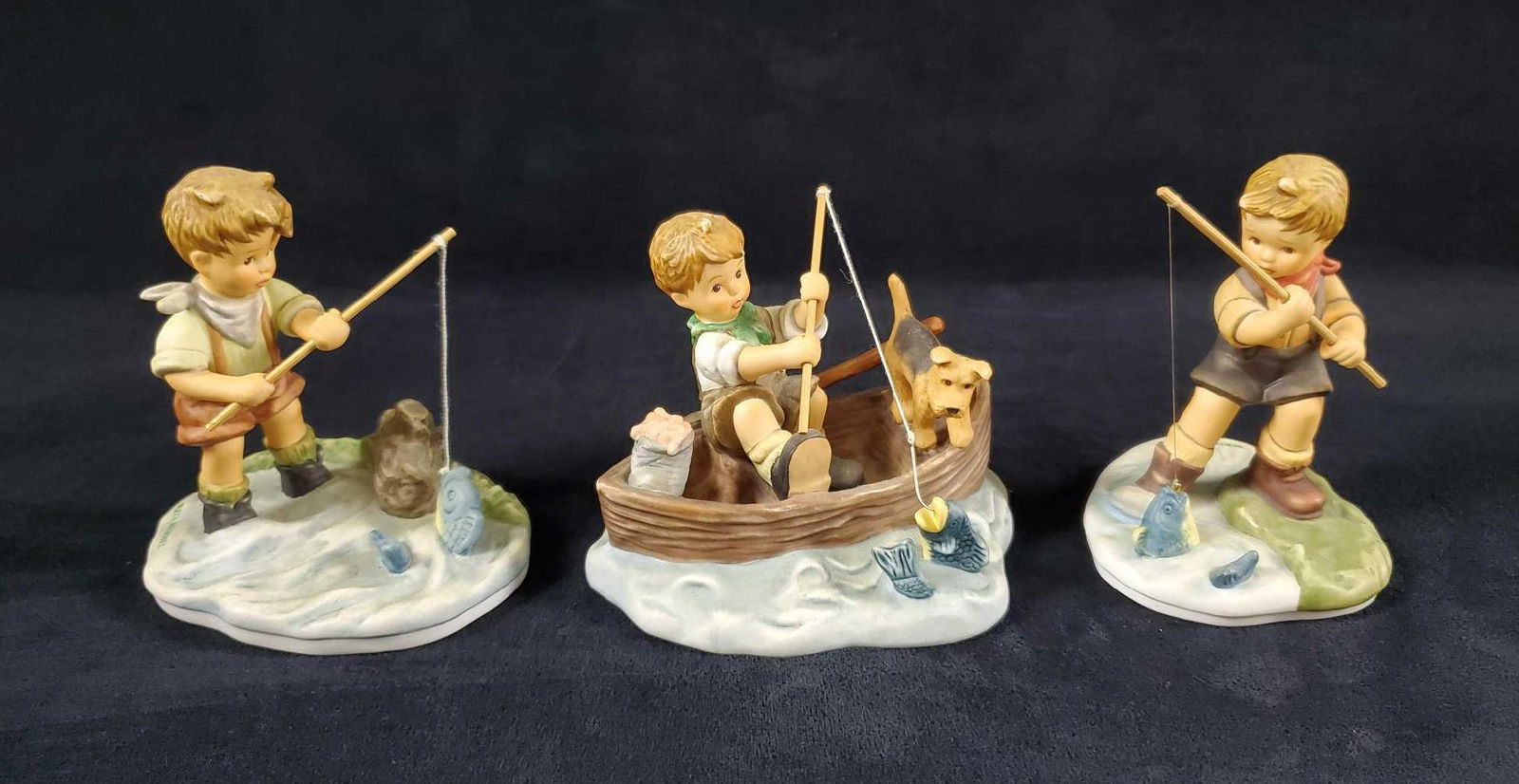 3 Piece Fishing Goebel Lot Studio Hummel: This 3 piece fishing lot by Goebel, Studio Hummel features: (1) "Hang On". Manufactured in 2003. Sku BH225. This is an authentic Berta Hummel figurine from the Boys will be boys collection. Coa includ