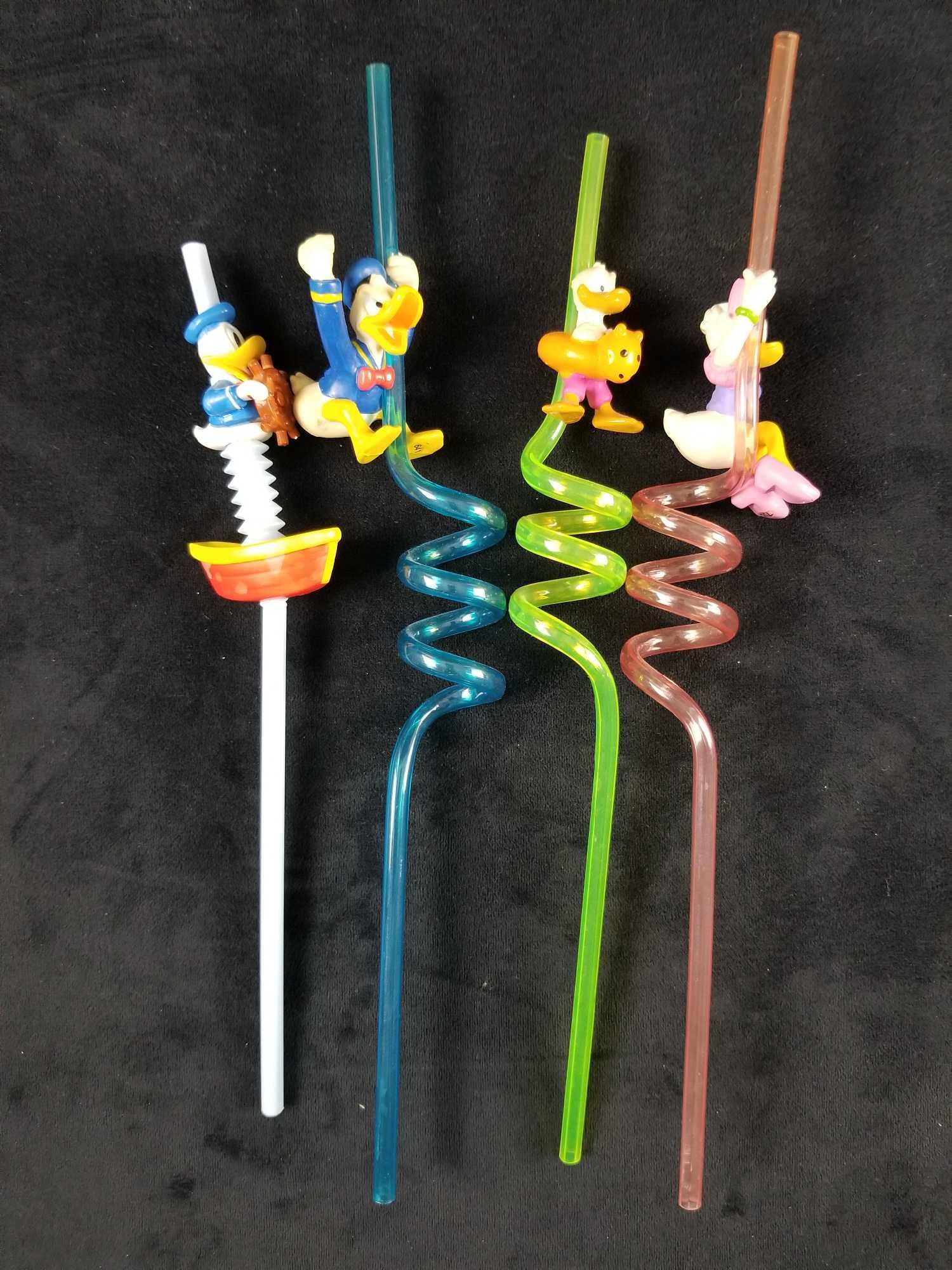 Vintage Disney Donald Duck Crazy Drinking Applause: Vintage Disney Donald Duck Daisy Crazy Drinking Applause Straws Donald Duck and Daisy in various character poses hanging on a colorful plastic straw. The lot is from a private collection. In great unu