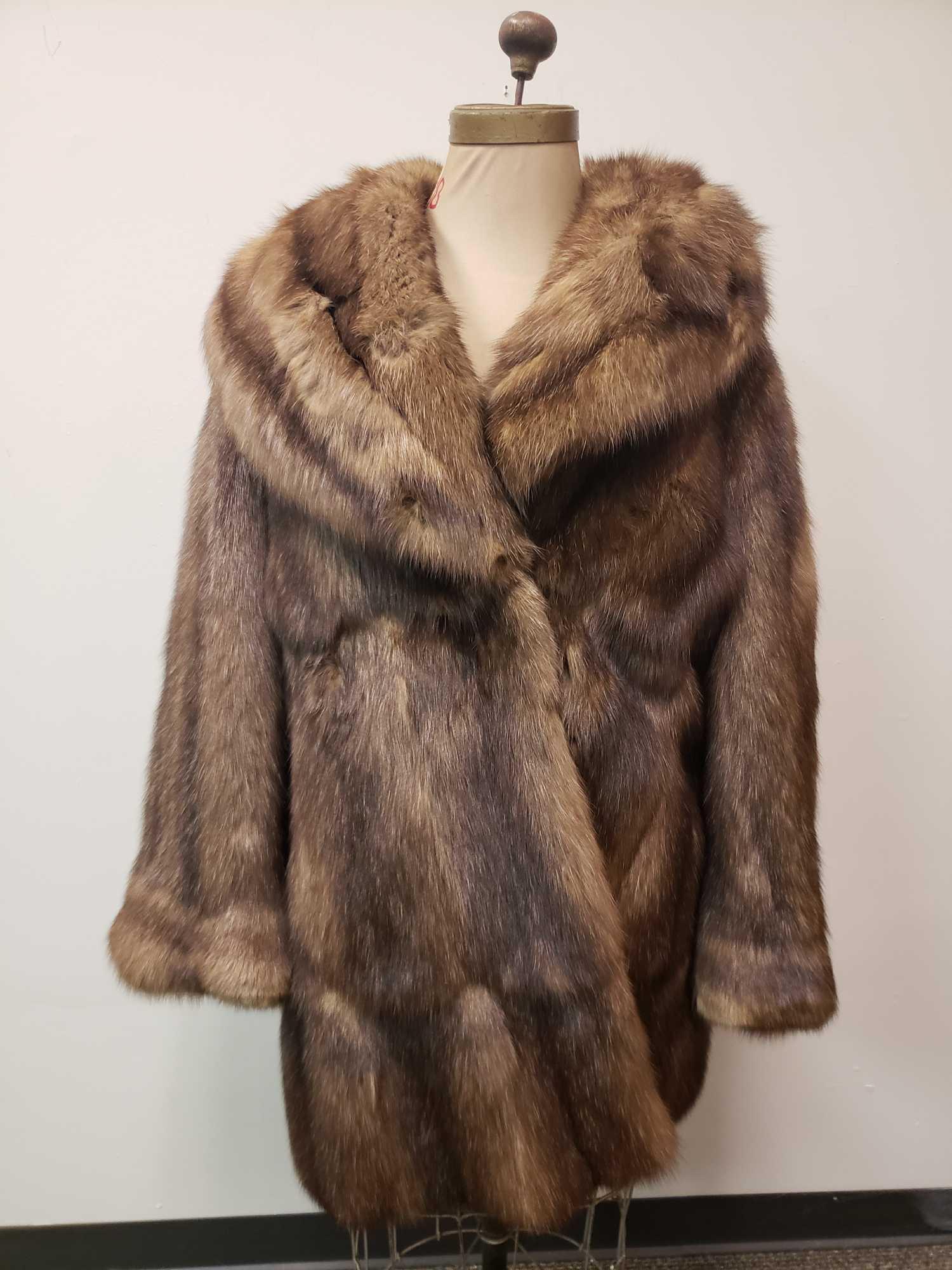 Guy Laroche Sojuzpushnina Sobol Russian Sable Fur Coat: Guy Laroche Sojuzpushnina Sobol Russian Sable Fur Coat. This coat is in great used condition. There is no known damage to the coat. The coat has two exterior pockets and a diamond pattern brown fabric