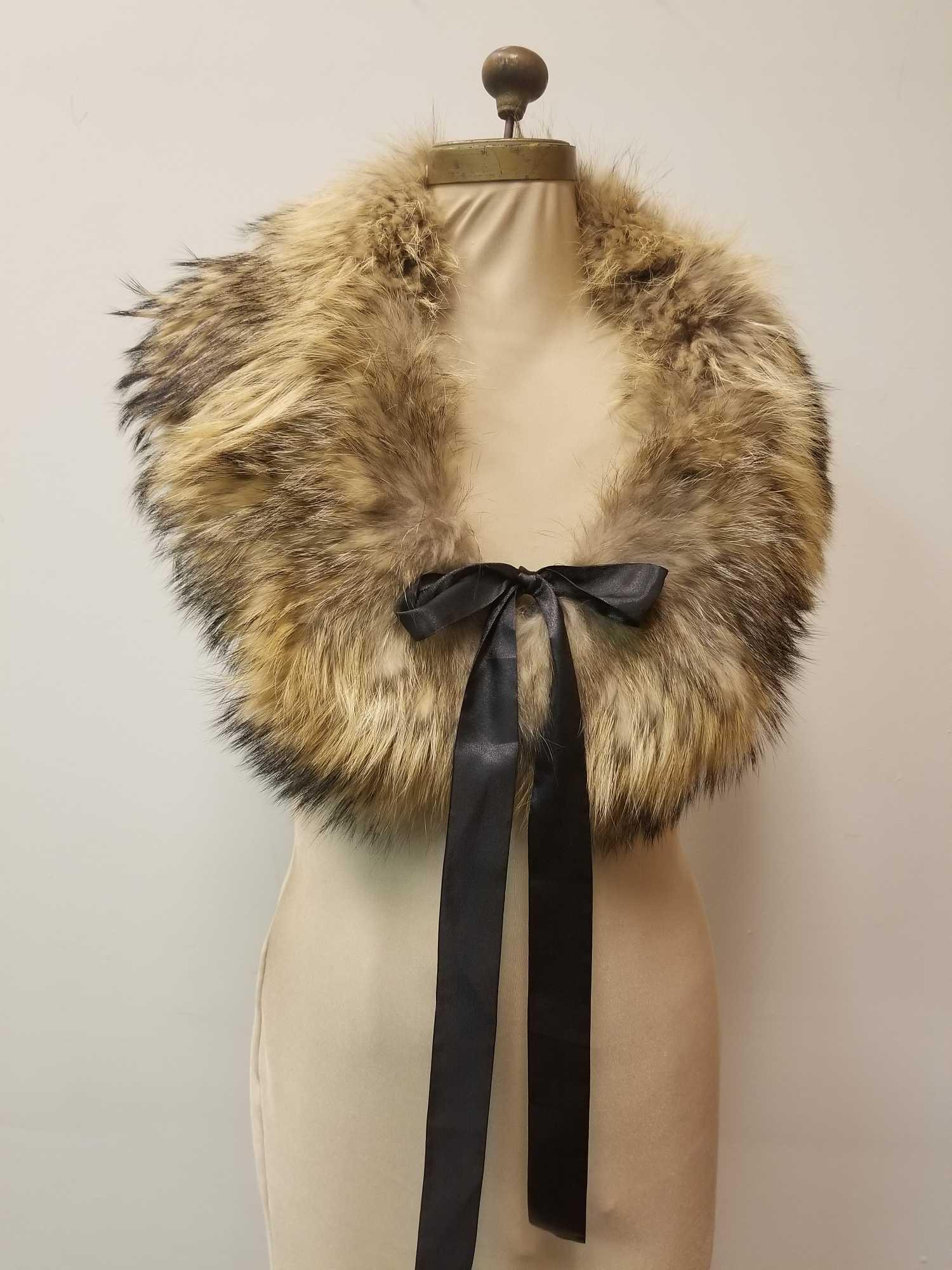 Golden Fox Shawl Stole Wrap With Black Ribbon by: This full and luxurious golden fox shawl by Admuka Artic Store features a sweet black ribbon tie and also a metal clip and loop for closure with black diamond quilted interior. In very good condition 