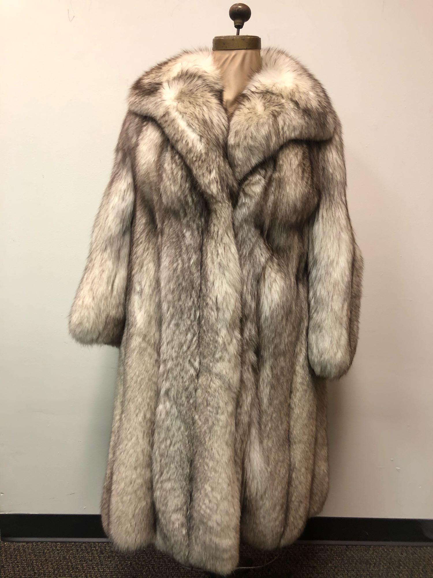 Fashion Fur Fox Coat Blue Full Length: Fashion Fur Fox Coat Blue Full Length. This coat features two exterior pockets and two metal fastener hook and eye closures an attached interior satin belt. The interior of the coat is fully lined in