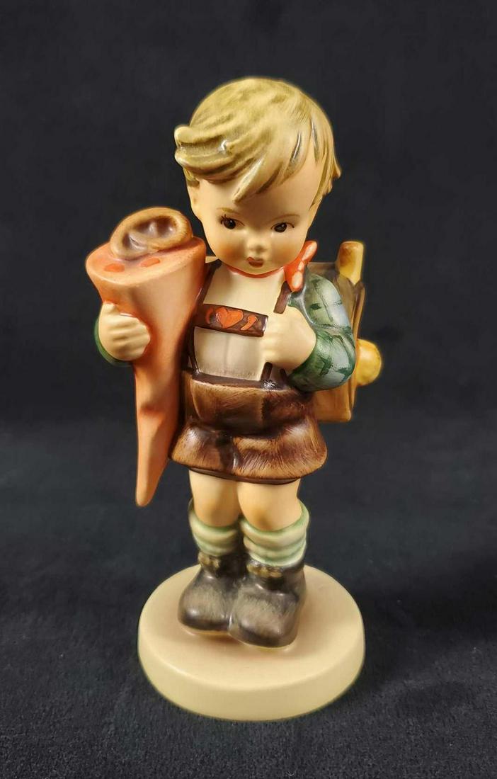 Rare Hummel Goebel Figurine Little Scholar HUM 80: Dressed in traditional lederhosen, this Bavarian boy readies for his first day of school. He carries a backpack and a paper cone, called a schutute or zuckertute. The figure is in good, vintage condit
