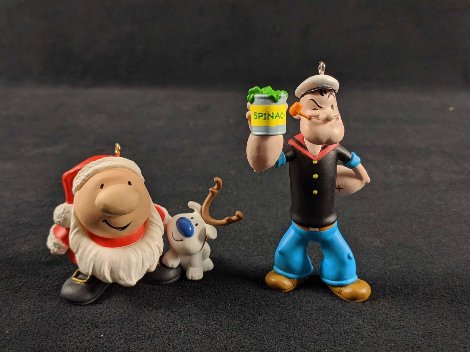 Hallmark Keepsake Popeye And Ziggy Ornaments: This lot includes one Popeye The Sailor Man ornament. This is approx 2" x 2" x 4". And Ziggy is approx 3" x 2" x 3". Both ornaments are in good, used condition with noticeable markings or scratches.&n