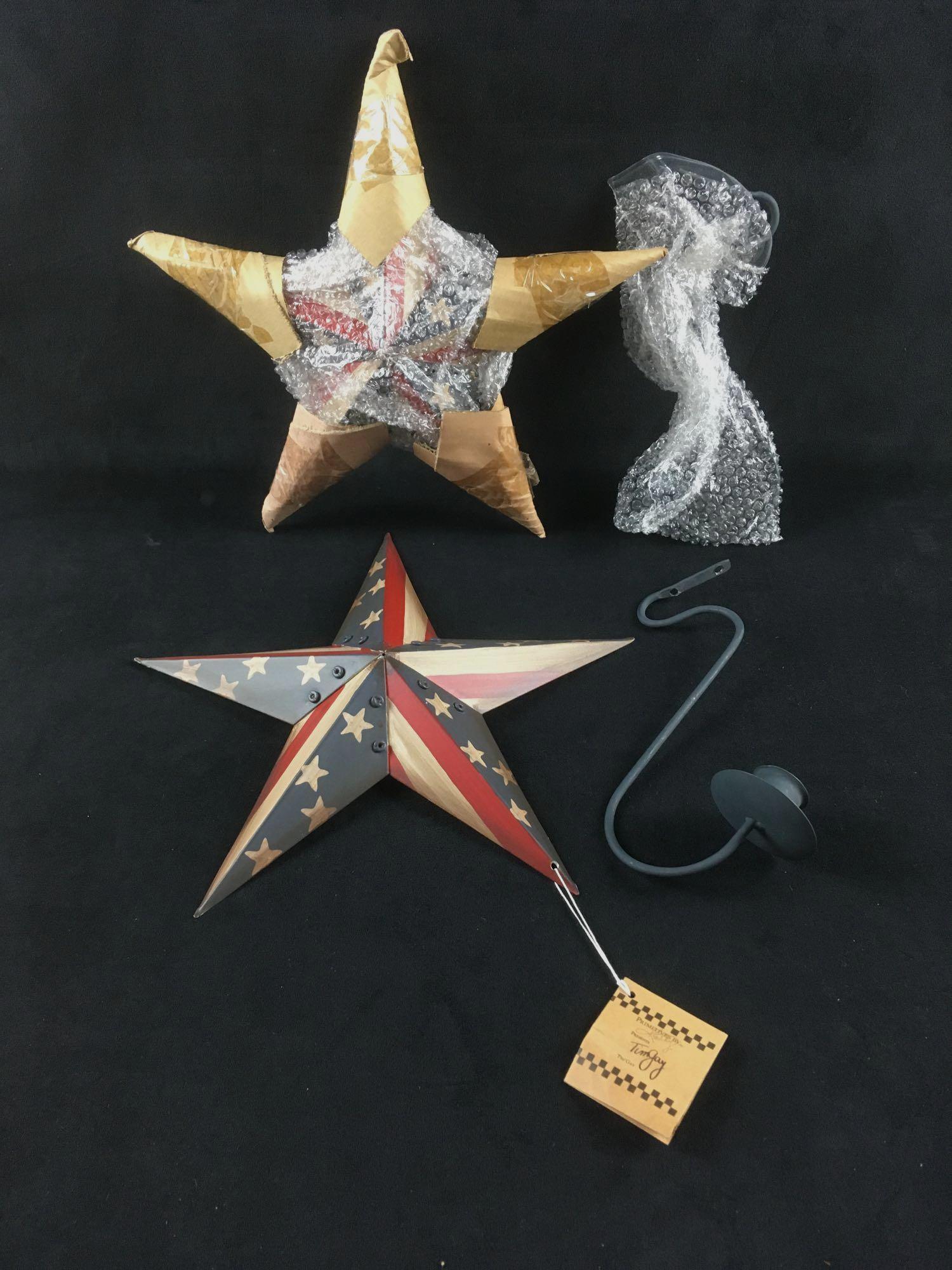 Pair of Tim Gay Americana Candle Sconces from: Pair of Tim Gay Americana Candle Sconces, Primitives by Kathy, New Old Stock; a pair of metal American stars, each with a detachable candle holder. Designed by Tim Gay. Great decor for 4th of July. Al