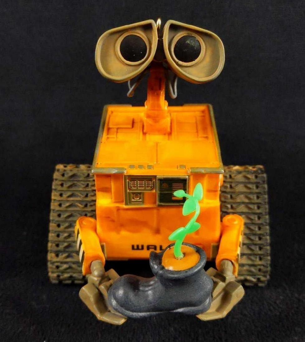 Hallmark Keepsake Wall E Christmas Ornament: This is a 2015 battery operated WALL-E Christmas ornament from Hallmark Keepsake collection. It is new in box and was only taken out for picture purposes. Batteries are included. Box measurement