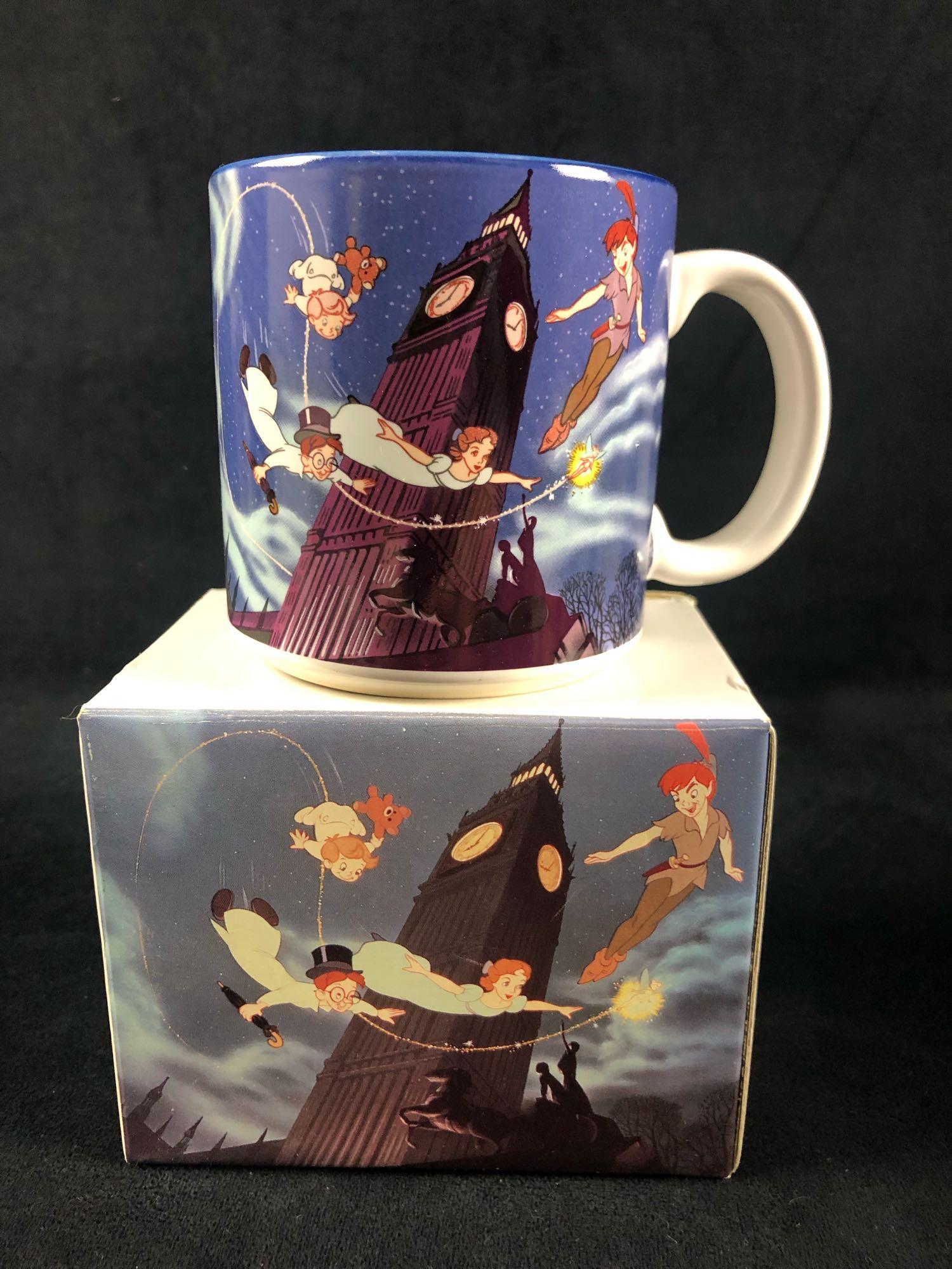 Vintage Walt Disney Classic Peter Pan Tinkerbell Wendy: The souvenir mug is made from ceramic and features a colorful movie scene from Peter Pan flying with Tinkerbell, Wendy, Michael, and John. The mug is in great condition with no known damages suc