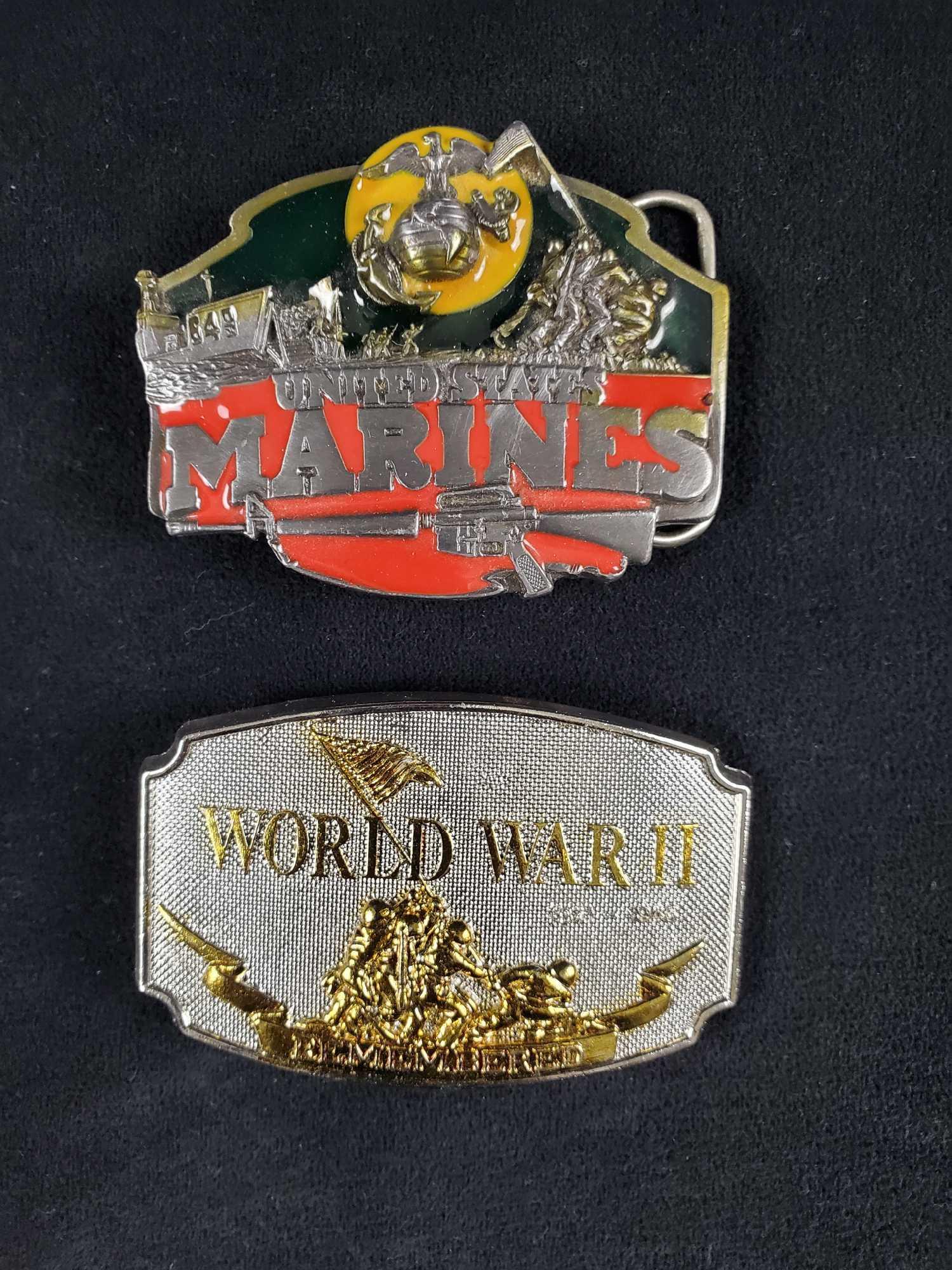 Vintage United Marine Belt Buckles Lot of 2: (1)World War 2 Remembered 1990 Belt Buckle. This belt buckle is silver and gold tone embossed and depicts the iconic 70 year old photograph of marines raising the American flag over the battle scarred