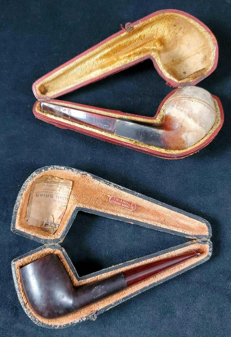 2 Vintage Smokers Wooden Pipes Bakelite and Meerschaum: (1) Triangle Bakelite WDC vintage smoker's pipe. This vintage piece features a burgundy shank and a black wooden bowl. It has the manufacturer's marking etched on the wooden part of the shank. It is i