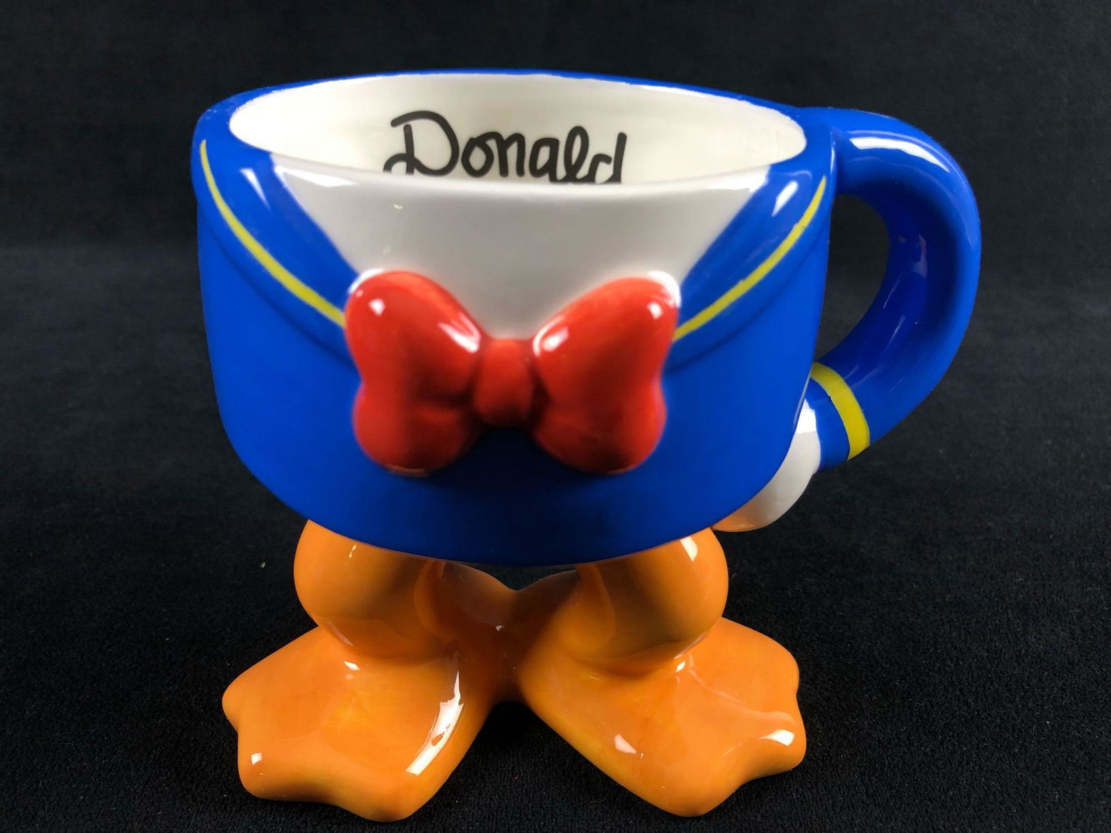 Vintage 3D Donald Duck Figural Legs Mug Cup Disney: Vintage 3D Donald Duck Figural Legs Mug Cup Disney Parks Coffee Tea Collectible Ceramic Donald's legs are ready for a beverage. Donald's name inside the mug with his arm extended out for you to hold.I