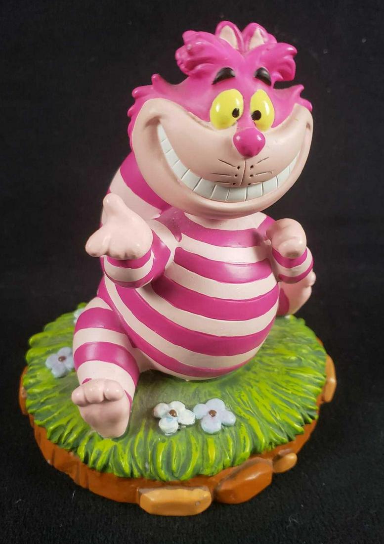 Rare Disney Alice in Wonderland Cheshire Cat Bobblehead: Rare Disney Alice in Wonderland Cheshire Cat Bobblehead Figurine. This bobblehead figurine is in great used condition. The item has no known damage to it such as paint loss, chips or cracks. The figur