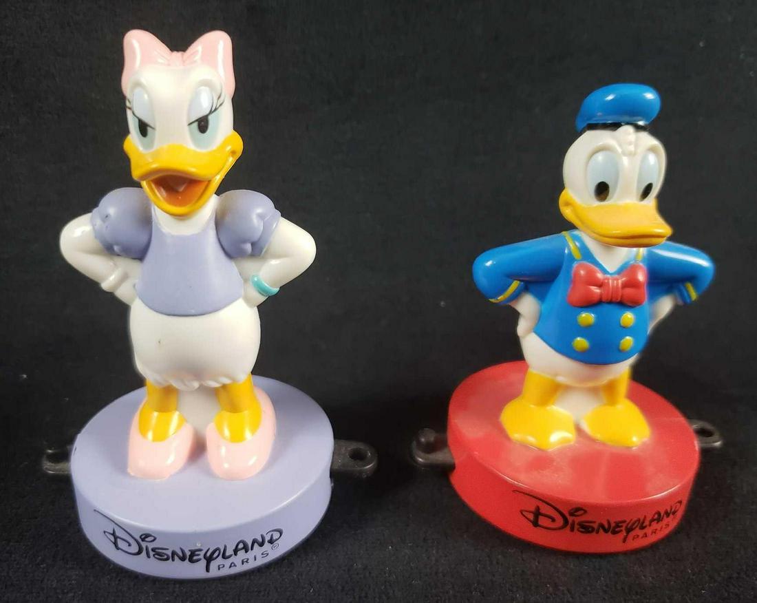 Vintage Disneyland Paris 1999 Donald and Daisy Duck: Vintage Disneyland Paris 1999 Donald and Daisy Duck. This lot of two Disneyland stamps is in overall great condition. The stamps show no known obvious damage such as paint loss or breakage. The stamps